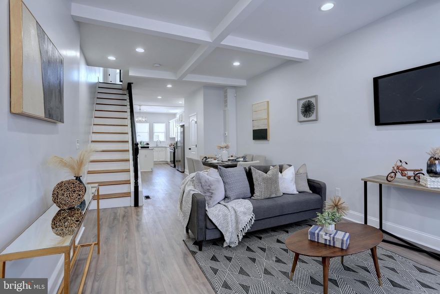 Stunning residence in the heart of Baltimore. 3 Bedrooms, 3  1/2 baths Plus a bonus room.—a perfect fusion of urban sophistication and timeless elegance. Recently renovated top to bottom to perfection!!! This architectural masterpiece pays homage to Baltimore's rich history, seamlessly blending classic charm with modern amenities. Every detail of this home reflects meticulous design and craftsmanship, ensuring a luxurious living experience for its fortunate owners. Step inside to discover an inviting, sunlit-filled living room. gorgeous kitchen with a designer island, granite countertops, stainless steel appliances, and a separate formal dining area—perfect for entertaining guests. The upper level is a sanctuary featuring an owner's suite with a full bath. A versatile bonus room ideal for an office, studio, or library.  Second bedroom with a conveniently located full bath in the hall. No more lugging laundry up and down stairs, as the washer and dryer are thoughtfully placed on the upper level. The fully finished basement offers a spacious family/rec room, a third bedroom, and a third full bath. Fully fenced rear yard. Situated in a great location, this home is convenient to Patterson Park, and Johns Hopkins Hospital. Immerse yourself in the local culture, and dine in renowned eateries, and desirable green spaces—all within blocks of your front door. 421 N Lakewood is not just a residence; it's a lifestyle—a true gem in Baltimore that promises an unparalleled living experience. Don't miss the opportunity to make this extraordinary property your home.