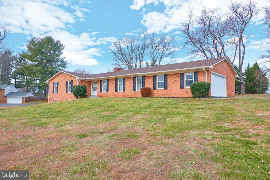 All brick Rambler ready for your personal touches.  Property only needs updating on the interior.  
Main Level Living includes Living Room , Dining and Family Room with hardwood flooring.  All Bedrooms, including the Primary are on Main Level.  Vintage bathrooms and kitchen.   Large Family room with brick hearth fireplace and new sliding door to rear.   Finished Lower Level with built in wet bar.  Lots of Storage and another full size 4th Bedroom.  Lower Level Fireplace, too!  Almost 2 acres in a private setting  Oil tank removed and replaced with electric heating.  Oversized 2 car garage and long driveway make this a great place to call home.   Please note that property percs for 3 bedrooms.  
ROOF IS 15 YEARS OLD, HVAC IS 2 YEARS OLD.  Windows original.   This is a great home to update  or live in now and is Priced to sell.