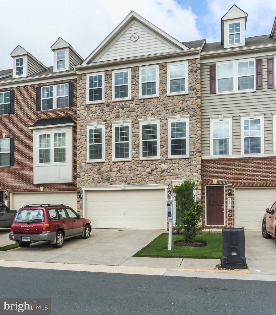 Back on the Market!  This must see this , gorgeous stone front, 3 level town home, features many builder upgrades including bump outs on all 3 levels.  This spacious 3 bedroom, 3.5 baths has a gourmet eat-in kitchen with granite counter tops, double ovens, and huge butler pantry with trex deck off the kitchen. Stunning hardwood floors throughout, lower level recreation room with walk out and 2 car garage on a premium lot with view of open common area. Come and see the home you've been waiting for!