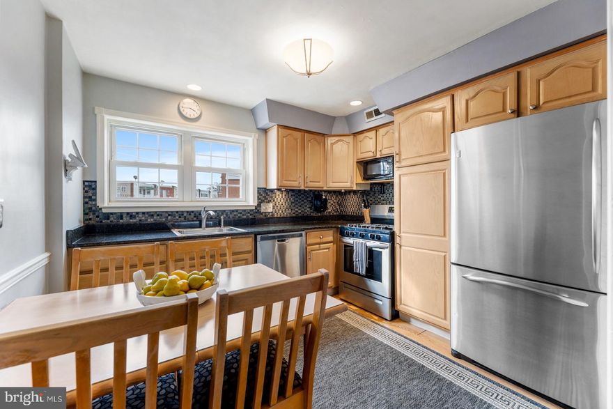 This is a beautiful home in Morrell Park which has been owned and cared for by the same family for over 56 years.  This home has an updated eat-in kitchen with lots of natural wood colored cabinets,  stainless steel appliances (refrigerator, dishwasher and gas stove), a  garbage disposal, granite counter tops and a tile backsplash.  There is a full dining room with a chandelier and a nice size living room with lots of windows for natural light and faux fireplace/mantel.  There is neutral carpeting and paint throughout.  There are three nice size bedrooms upstairs and a full updated bath with a skylight, newer tub surround and a newer vanity.  There is a balcony/deck off the master bedroom.  There is a full basement with garage access, a laundry room (washer and dryer included)  and a powder room.  There is a large back covered patio for outside enjoyment and a large fenced back yard.  The garage door is newer and has an electric garage door opener.  This home has updated Central air conditioning.  The Seller is willing to leave the dining room set (table, chairs and cabinet), faux fireplace/mantle, living room couch and bedroom furniture as shown.  If Buyer is interested in furniture please specify in agreement of sale.  This home is situated on a nice block with driveway parking and lots of additional street parking!  This home is walking distance to public transportation (bus and train) and walking distance to both public grade school and middles school (John Hancock Demonstration Elementary and Middle Schools).   Call to show!  This home won't last!