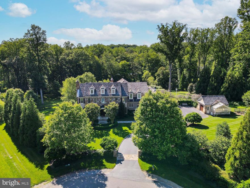 This beautifully designed custom home built by Artisan Builders is nestled at the end of a quiet cul-de-sac on almost 2 acres that backs to over 5 acres of private historic preservation area. Masterfully crafted with high-end finishes inside and out. The Main Level includes Entry Foyer with custom wall coverings, custom art glass windows & sidelights, Living Room with coffered ceiling and marble fireplace, Dining Room with custom paneling & Italian plaster walls, Library/Office with custom Mahogany built-ins and paneling, Chef’s Kitchen with Lobkovitch cabinetry, top-of-the line appliances, walk-in pantry and breakfast area, Den/TV Room with surround sound system, large Mud Room, 2 Powder Rooms, multiple fine art chandeliers, and Sun Room with heated floors. The Upper Level has an Owners Suite with luxurious Spa Bath, double vanities with Perrin and Rowe fixtures and custom closets with built-ins. There are 3 additional en Suite Bedrooms with walk-in closets and separate heating and cooling zones. The Lower Level is great for entertaining and includes a Recreation Room with Fireplace, Wet Bar, Laundry Room, Utility Room, Storage Room, and Fitness Room. From the rear Loggia you overlook the stunning landscaped oasis by Charles Owen with Fine Landscaping featuring gorgeous gardens, elegant fountains, patios, fire pit, lush lawn and mature trees. There is also a charming English Greenhouse by Hartley Botanic and vegetable garden with irrigation on the property. This rare and special property offers a tranquil setting as well as convenience with minutes to Riverbend Country Club, Great Falls Swim & Tennis, Great Falls Village Center, Great Falls and Riverbend National Parks, great public and private schools, wonderful restaurants and shopping in Great Falls, Tysons and the Reston Town Center.