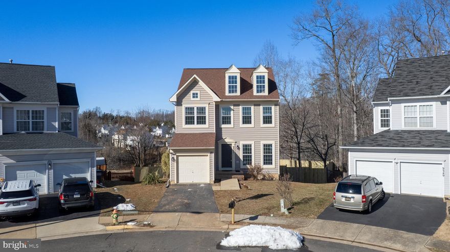 Tucked away at the end of a peaceful cul-de-sac, this stunning 3-bedroom, 3.5-bathroom home is a true retreat! With a brand-new fence enclosing the expansive backyard, you’ll love the privacy and serene views of the pond and woods beyond. Inside, the light-filled, open floor plan shines with recessed lighting, fresh paint, and gleaming wood floors on the main level. The bright and airy kitchen is a chef’s dream, featuring granite countertops, a massive island, and brand-new stainless steel appliances, including a microwave, dishwasher, and stove. Cozy up by the gas fireplace in the family room or host memorable dinners in the separate dining room, which opens to a beautifully refinished deck—perfect for entertaining or simply unwinding. Upstairs, the spacious owner’s suite boasts a generous walk-in closet and a luxurious en-suite bath with a corner soaking tub and dual vanity. The brand-new carpet adds a touch of comfort to the stairs and upper level, while the partially finished walkout basement offers endless possibilities. Thoughtful updates like new exterior light fixtures, a brand-new water heater, and a completely replaced HVAC system (indoor and exterior) with vent cleaning ensure peace of mind. A perfect blend of charm, comfort, and modern convenience—this home is ready for you to move in and make it yours!