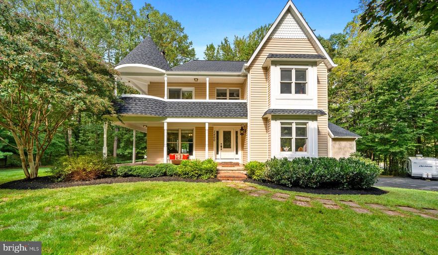 Welcome to your very own CASTLE IN THE WOODS!!  This gorgeous Victorian boasts over 3,300 square feet of finished living space and is privately nestled on a 2 acre wooded lot.  You will fall in love with the nature around you as you enjoy the views from the main level wrap-around porch which leads to a massive composite deck with entrances to the kitchen and great room. The main level provides sprawling space for entertaining including the eat-in kitchen, living and dining room with wood burning fireplace, a large office with multiple windows (can also double as 6th bedroom), a sizable great room with cathedral ceilings, a bedroom/laundry room and powder room,   You will feel like royalty on the upper level in the spacious primary ensuite as you enjoy morning coffee on the covered balcony.  The large walk-in closet and full bath with double vanity, shower and soaking tub makes pampering yourself easy.  There are also two additional bedrooms and a full bath on this level.  The lower level efficiency can serve as a bedroom, potential income producing efficiency, au pair apartment or multi-generational living area with a separate entrance, complete kitchen and full bathroom.  The roof was replaced in 2023 with 30 year architectural shingles, the whole house has been freshly painted, harwood floors refinished and all new carpeting & padding installed, the great room heat pump 15 SEER was installied in 2023, and the main house high efficiency Carrier was installed in 2015.  You will never run out of storage at this property!  The oversized three-car garage and workshop leads to an additional storage area as well as the climate-controlled and insulated large crawl space.  There is plenty of parking for cars, boats and all of your recreational vehicles outside on the looped driveway. A potential fourth level is located in the spacious attic with current entrance via primary suite. This property is conveniently located to so much:  Community parks, Golf courses, riding stables, shopping and restaurants. This neighborhood has direct access to Bacon Ridge Natural Area with 20 miles of natural surface multi-use trails.  Fort Meade, Annapolis and Baltimore are nearby.