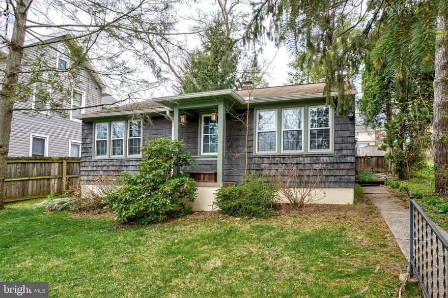 OPEN HOUSE - Sunday, April 19th, 1:00 - 2:30 PM.  This charming ranch-style cottage is just 5 blocks from Penn State campus and brimming with character. Significant updates were completed in 2015 and 2016, including the installation of all new windows, upgrades to the electrical system, and the addition of new interior and exterior light fixtures. The interior has been freshly painted throughout.  Features include gleaming hardwood floors, a full tiled bath, a half bath, a spacious living room w/ fireplace and built in shelving, and a light-filled dining area. Enjoy custom built-ins, abundant storage options including attic space, and an outside entrance to a partial crawl space. The property offers three off-street parking spaces accessible via the rear alley, a fenced yard with metal and stockade fencing, and a picturesque pathway with stone walls leading to a large, entertainment-friendly patio. Conveniently located near the PSU campus and downtown State College, this home also holds an active rental permit for three unrelated non-student occupants.