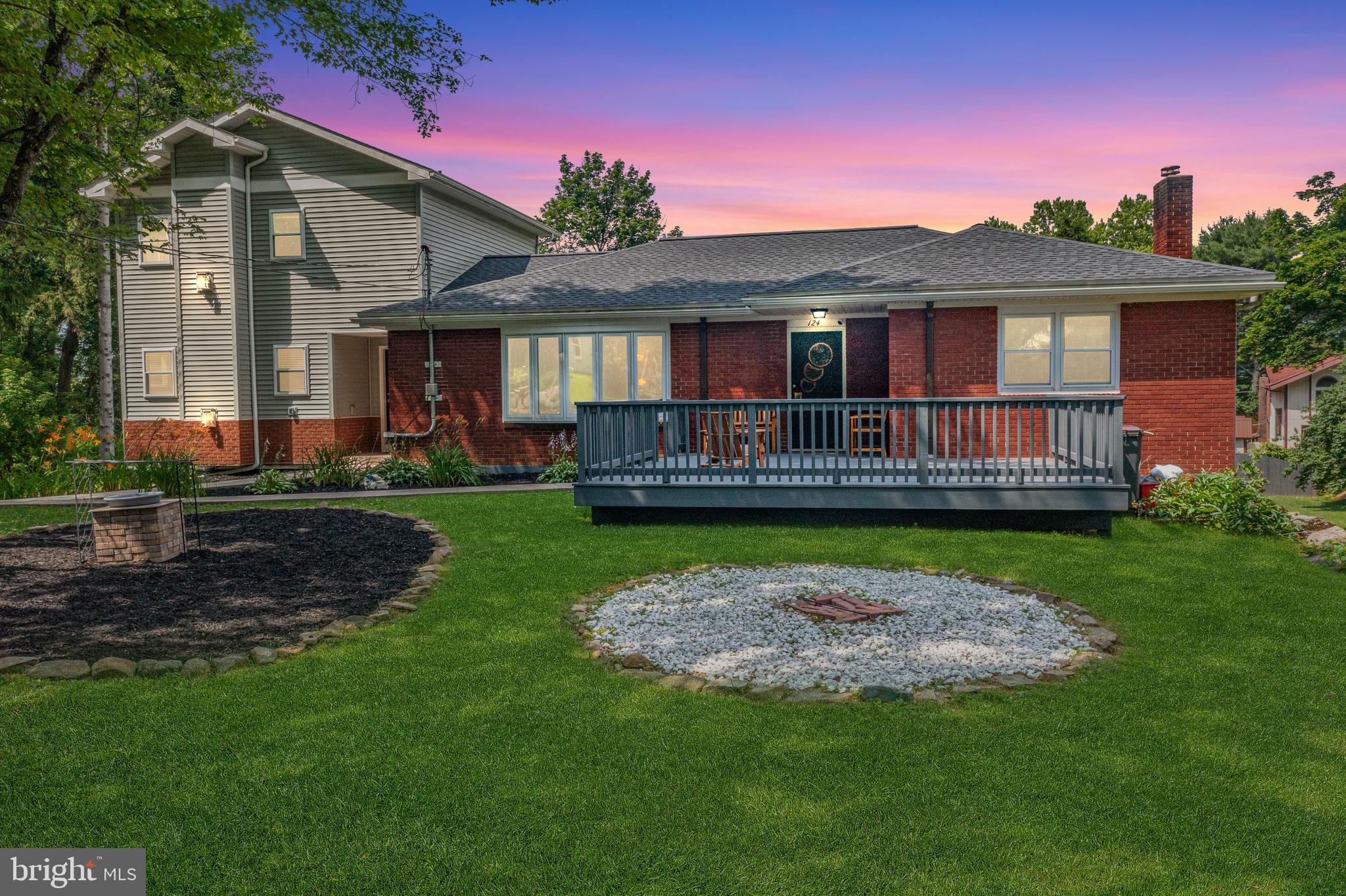 Tucked away on a quiet cul-de-sac in the desirable State College Area School District, this spacious 6-bedroom, 3.5-bathroom home offers versatile living with room for everyone. A stunning two-story addition, completed in 2011, adds a luxurious owner’s suite with a cozy fireplace and private bath, as well as an upstairs family room with a second fireplace, additional bedroom, and powder room—perfect for guests or extended family. The main level features an inviting eat-in kitchen with granite countertops, warm hardwood flooring throughout the living room and bedrooms, and classic charm in every corner. The walk-out lower level includes a bedroom with a full bath and kitchenette, ideal for multi-generational living or rental income, thanks to the existing rental permit. Step outside to enjoy the expansive backyard—plenty of room to garden, play, or entertain with the paver patio and firepit. Brand-new mini-split systems for efficient heating and cooling and a premium cul-de-sac location, this home is truly a rare find in State College.