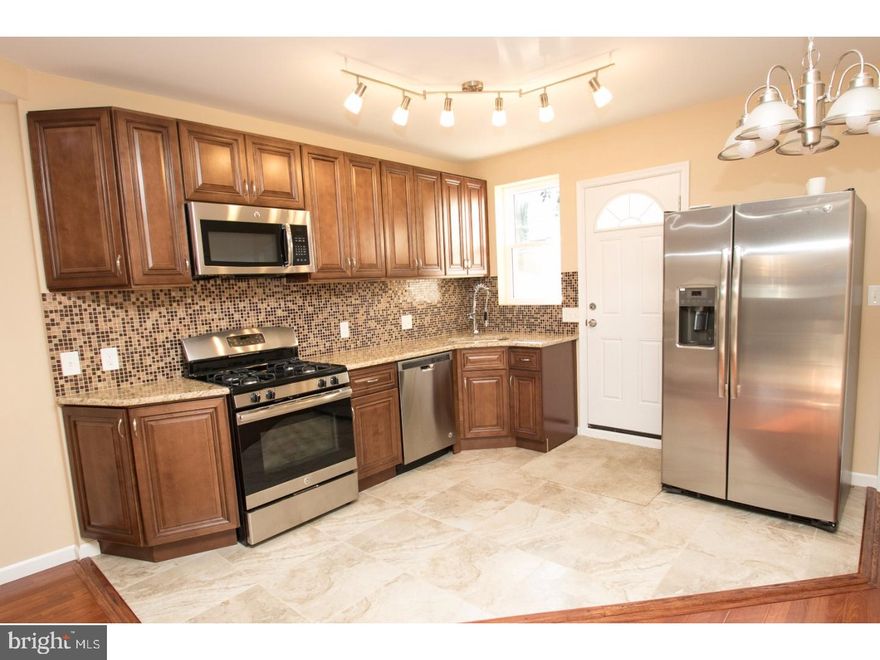 Unbelievable newly renovated home, very conveniently located! The entire home has been newly rehabbed top to bottom. Do you like elegance? Well this home is one of a kind and offers every extra a buyer could desire. All of the windows have been replaced, and there is a new roof w/ warranty, all new siding, updated electrical & plumbing, and not to mention new energy efficient Heating & AC Units! The 1st floor features a huge open layout with hardwood floors, recessed lighting, a new kitchen, which features granite counter tops, and stainless steel appliances. The upstairs features three sizable bedrooms, and a state of the art spa bath w/ custom Italian Ceramic tile. There are two additional half baths. This home truly has it ALL and is a MUST SEE!