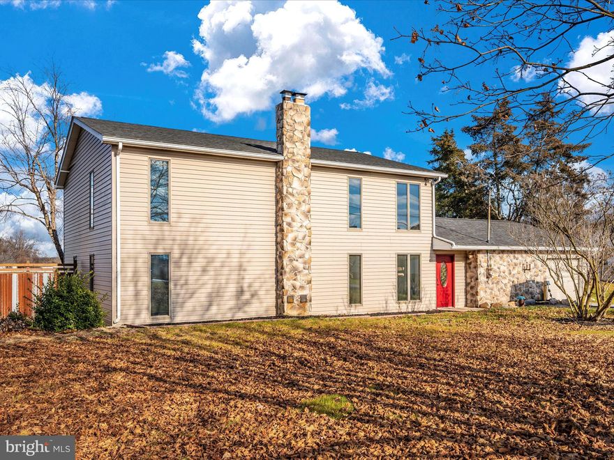 If you want an open floor plan, this is your home!  Nearly 3,000 square feet, 3 bedrooms, 2 full baths (one on each level).   Beautiful kitchen with a large pantry and plenty of space for a large table.   Spiral staircase, New roof, All new hot water heater, lines, well pump, and water softening system!   HVAC wall units with back-up oil heat, baseboard electric, and a wood stove!   Well water and public sewer.   Large garage with workshop/storage.  Two-level deck off the kitchen on the upper level, and a smaller deck below, with direct walkout via sliding glass door.  Storage shed and fenced yard!  Gorgeous views out back!!  **Price reduced**