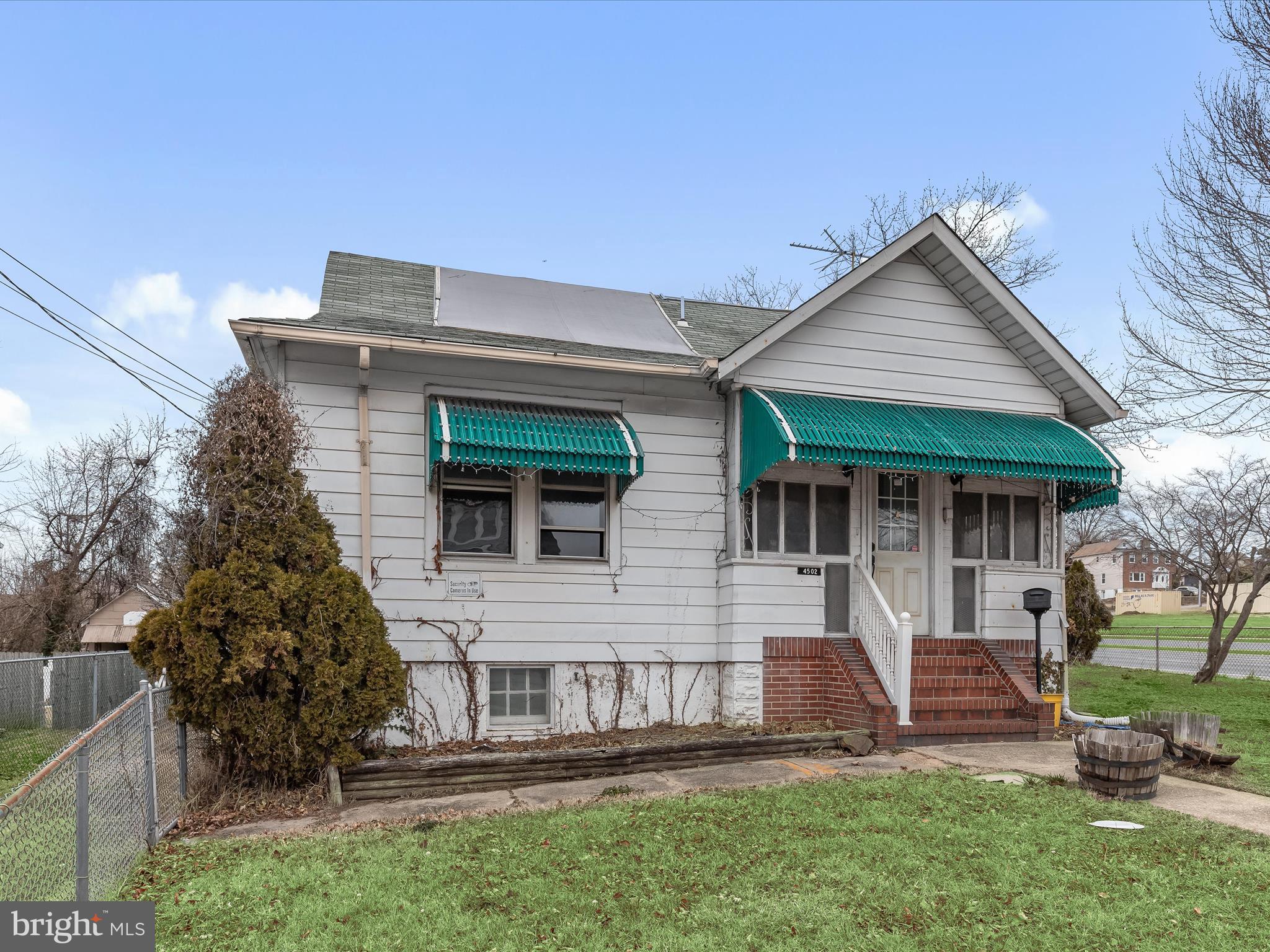 Situated on a spacious fenced corner lot, this AS-IS 3-bedroom, 1 full and 2 half-bath bungalow-style home is brimming with potential! Whether you're a first-time homebuyer eager to bring your vision to life or an investor searching for your next project, this property offers endless possibilities. Inside, the home features an inviting enclosed porch/sunroom, kitchen, and dining area plus two main-level bedrooms, an upper-level office, and a bonus room as a possible third bedroom providing a solid foundation for renovation. The unfinished basement presents additional space for storage or future expansion, while the detached garage adds convenience and value. Offered strictly as-is, this home is ready for your creative touch. With the right updates, it could become a true gem in the neighborhood! Major commuter routes include I-895, I-95, I-695 and MD-Rt. 1. Don’t miss out on this fantastic opportunity—schedule your showing today!
Note: Buyer to verify ground rent. Select interior photos have been virtually staged.