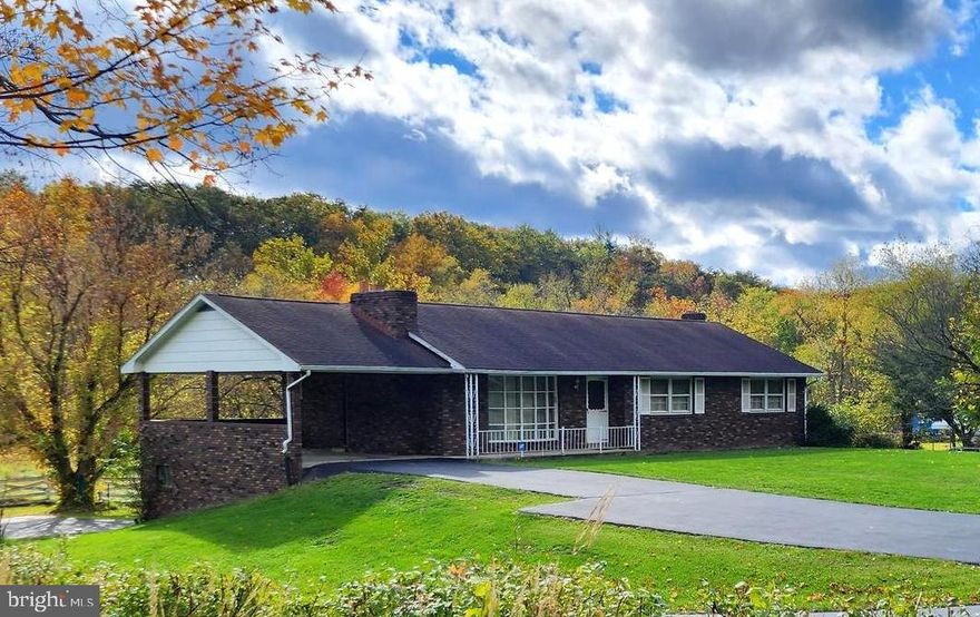 Quiet, peaceful, serene is this charming all brick home nestled in the beautiful Mountain Side of Maryland,  featuring 4 bedrooms, 2.5 baths main level living, hardwood floors,  2  woodburning stone fireplaces, the home features a plet stove  and woodstove for those utility savings, heatpump, central air, a finished basement with mini kitchen, main level provides combination living, dining, kitchen area with open concept layout, boasting of 1.5 acres and backs to the C&O Canal, basement gararge and separate detached garage, barn/garage also on the property, some fencing,  ready for you to enjoy evenings on the porch/carport and conveniently located a few minutes from Cumberland which includes a regional medical center, UPMC of Western MD, check it out before it's too late!