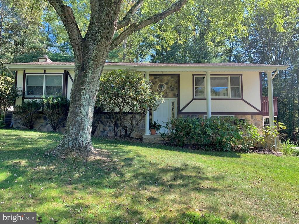 You are home. Lovely Contemporary home on 2.74 acres just out of town, yet still very close. Only 20 minutes to State College and 25 minutes to Penn State. This 2-3 bedroom home boasts 2424 sqft, hardwood floors, ceramic tile, open floor plan, vaulted ceiling, central air, gas fireplace, tons of natural light, and a sunroom with included hot tub. On the beautiful 2.74 acre lot that backs to woods you'll find a heated in-ground pool, gazebo, pond, 2-car detached garage with second floor & skylights, fenced-in garden & orchard, and lovely views. Located near Shaver's Creek, Whipples Dam & Greenwood Furnace State Park and close to fishing, hunting & state game lands. One year home warranty included.