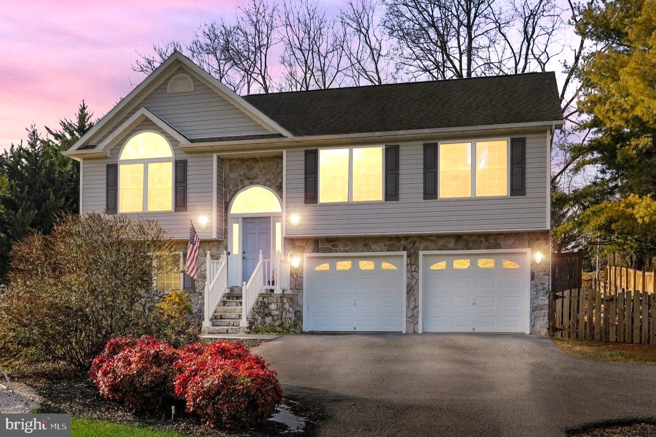 **Deep water Potomac River access**
Here's your chance to own a home in the desirable riverfront community of Glen Haven, located in Harpers Ferry, West Virginia! This is one of the only locations in Jefferson County where the river is deep enough for water sports like wakeboarding, waterskiing, jet skis, and lazy afternoons on the pontoon boat! Owning property in this community gives you access to the private boat ramp, recreational river lots, picnic pavilion, and a basketball court. All of these amenities are provided with low HOA fees! This gorgeous home provides amazing mountain views and is just a short walk to the river! The upper level offers an open layout and features vaulted ceilings that enhance the spacious feel. The kitchen is highlighted by the beautiful dark floors and blue subway tile backsplash, which provide a stunning contrast to the white countertops, cabinets, and appliances. The primary bedroom features tray ceilings and an en suite bathroom. Also on the upper level, you will find two more bedrooms and a hall bath. The lower level has a large finished space that would be perfect as a recreation room or could be utilized as a 4th bedroom. The lower level also offers a 3rd full bath, laundry, and access to the oversized two-car garage. The fully fenced backyard of this property is a true oasis! It features a large paver patio with a pergola and firepit, a kid's play area with a sandbox, an incredible stone water feature with a waterfall that runs into a pond, and an amazing outdoor shower! This property would make a great full-time residence, weekend getaway, or would be perfect as an Airbnb property. Local attractions include Harpers Ferry National Historical Park, the C&O Canal, the Appalachian Trail, an outdoor adventure park, snow tubing, breweries/wineries, and the Potomac River for activities such as white water rafting, kayaking, tubing, swimming, fishing, and various watersports. The location is great and makes for an easy commute into Northern Virginia. Amenities such as shopping, health care, MARC Train stations, community services, and several award-winning restaurants are just a short drive away. Schedule your private showing today to see what this amazing property and community have to offer! This home is eligible for up to $10,000 in down payment/closing assistance via the Journey Home Grant. Ask listing agent for more details. *Some photos have been virtually staged.