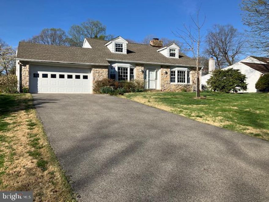 Welcome to 1036 Kipling Rd, a beautifully maintained and light-filled Cape Cod located in the highly desirable Crosswicks neighborhood in Rydal. This charming home offers the ease of first-floor living, complemented by a spacious layout and generously sized rooms throughout. Upstairs, you’ll find two well-appointed bedrooms, a full hall bath, and a large storage room featuring a walk-in cedar closet—perfect for keeping everything organized. Rich hardwood floors flow seamlessly throughout the home, adding warmth and character, while replacement windows bring in abundant natural light. The main level is designed for both comfort and functionality. A welcoming living room greets you upon entry, complete with a wood-burning fireplace, built-in shelving and cabinetry, and large windows that create an inviting atmosphere. The formal dining room continues the elegant feel with matching hardwood floors and second bay window. The spacious kitchen offers abundant cabinet and counter space and opens to a bright breakfast area.  A fabulous family room addition showcases a beautiful stone fireplace, vaulted ceiling with skylights and double French doors that lead out to a deck—ideal for entertaining or relaxing while overlooking the backyard. On the opposite side of the hall, the primary bedroom suite provides a private area with a full bathroom and a conveniently located main-floor laundry room. Additional highlights include a two-car garage, a built-in whole-house generator, a long driveway, and a generously sized backyard that enhances the property’s appeal. This home perfectly blends classic charm with modern convenience—ready for you to move in and enjoy.