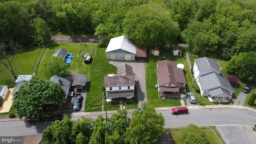 Located just moments from the Potomac River, this property in Paw Paw, West Virginia is full of potential and ready for someone with a vision. Offering a blank canvas to build new, this 0.27-acre lot comes with a spacious detached garage and no HOA, giving you the flexibility to create something truly your own.
Tucked away in a peaceful setting with the river just beyond the backyard, you’ll enjoy a quiet atmosphere while still being close to town amenities and outdoor recreation. Whether you're dreaming of a weekend escape, a full-time residence, or an investment property, this location offers a rare opportunity to start fresh in a charming riverside community.
Bring your plans and creativity—this property is ready to be reimagined.