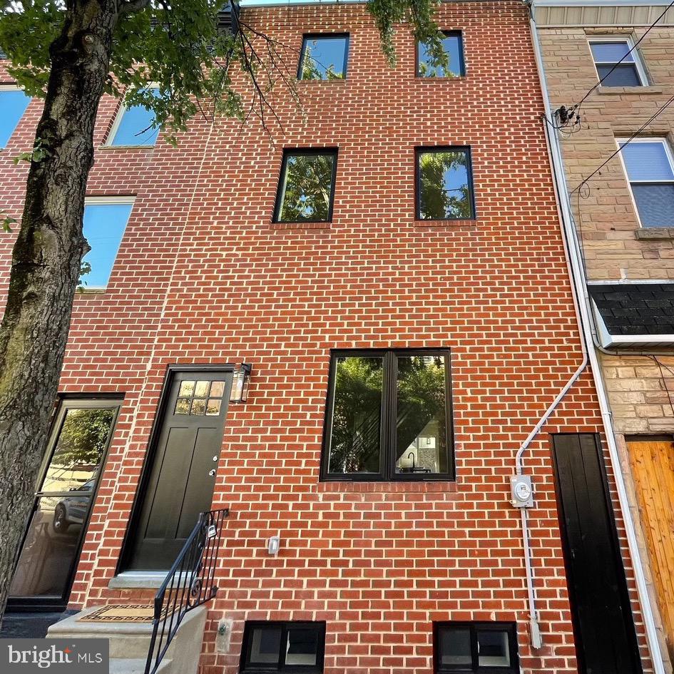 Coming Soon to market on September 9th ! 422 E Wildey Street is a completely renovated 3 bed, 2.5 bath home with a finished basement on one of the nicest tree lined blocks in Fishtown. Nothing in this house was left untouched. The home features a timeless brick façade, large plank hardwood floors throughout, OVERSIZED yard, finished basement, designer kitchen and baths, balcony space, and all new central HVAC, windows, plumbing, electrical, LED lights, roof, and more. The first floor is the ultimate entertainment space. Enter the home into an open concept living area with great ceiling heights leading to a dining area, kitchen and powder room. The kitchen features a large quartz island and counter tops, stainless steel appliance package, built in wine/beverage fridge, and undercounter Sharp microwave. Double sliding doors lead to the 650sf of outdoor living space ideal for pets, gardening, BBQ, and get togethers. The basement is fully finished for a second living area with luxury vinyl plank floors and a laundry room with brand-new washer dryer units. The second floor hosts the primary bedroom, guest room, and hall bath. The owner’s suite features a private integrated balcony, beautiful closets, lavish bathroom with a sliding barn door, full glass shower, and double vanity. The third floor has an oversized third bedroom filled with natural light, vaulted ceilings, and large closet. This Wildey Street home speaks for itself and its location is unmatched. It sits on a quiet street in undeniably the most prestigious neighborhoods in Fishtown. Walk to all your favorite restaurants and shops in minutes and come home to your peaceful Fishtown oasis. Do not miss this opportunity. Schedule your tours now starting September 9th!