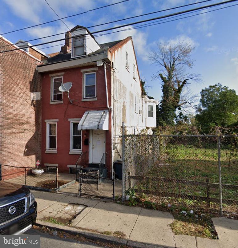 Set back from Orthodox Street, this 4–5 bedroom twin in Frankford East offers strong income potential. Features include a gated entrance, paved front yard, and solid structure with pitched roof and dormer windows. Main level has a flexible layout with possible office/bedroom, living room, full bath, kitchen, and rear bedroom addition. Upstairs has 3 bedrooms and a full hall bath. Third floor is a walk-up loft with pitched ceilings and dormer window. Stone basement with washer/dryer hookup and non-working heater. Deep 120-foot lot with large fenced yard. Great value in a growing neighborhood! Please note that the owner does not accept PAR agreements of sale and all offers MUST be made on attached forms. Forms must be notarized and if being purchased by an LLC, LLC documents must be included.