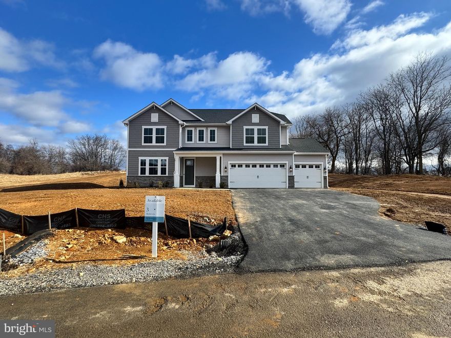This home is almost complete and ready to move into March 2025!  Welcome to Estates of Tuscarora, a brand-new community offering 1+ acre homesites within close proximity to commuter routes, shopping, parks, and Historic Downtown Martinsburg!  The Canterbury is a 2-story colonial home located on over 2 acres on Homesite #3.  This 3-car garage, 5-bedroom, 3 bath home blends timeless Farmhouse interior design with modern convenience! Offering an open floor plan, this home is perfect for both comfortable living and entertaining.  At the heart of the home is an inviting family room with a fireplace, seamlessly connected to the kitchen and casual dining area.  The well-appointed gourmet kitchen features GE Profile Stainless Steel appliances with range, hood vent, built-in wall oven and microwave; complete with a spacious island with quartz countertops and a farmhouse sink. A finishing touch on the main level is a rare find – an extra bedroom and full bath on the main level, ideal for guests, in-laws, or a home office.  The foyer includes a feature wall with trim and boxed oak staircase with an open railing, creating an elegant focal point leading to the upper level.  The upstairs includes a loft area, 3 secondary bedrooms, laundry room and spacious Primary Bedroom.  The Primary Bedroom boasts a feature wall with trim, tray ceiling and luxury bath complete with a frameless shower door and free-standing soaking tub. Imagine unwinding on the covered patio, a perfect outdoor retreat designed for relaxation and enjoyment, whether sipping your morning coffee as the sun rises, hosting a summer barbecue, or cozying up with a book during a gentle rain, this versatile space offers endless possibilities. This home is a perfect blend of charm, functionality, and space, designed to meet all your needs. Don’t miss the opportunity to make this remarkable home your own!  Call and schedule your personalized appointment today! Ask about our closing cost assistance with the use of KHovnanian American Mortgage! **Photos are virtually staged renderings and may not reflect current home finishes.  See Sales Consultant for more information**