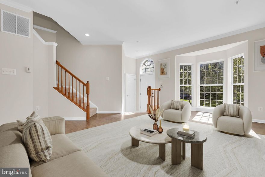 Freshly painted from top to bottom, this gleaming four-level townhome blends modern updates with spacious, light-filled living. With four bedrooms, three full baths, and one half bath, plus a detached one-car garage, the floor plan offers flexible space for every need. The main level with vinyl wood flooring welcomes you with a large, sunny living room that flows to a bright kitchen featuring stainless steel appliances, granite countertops, and table space with a new light fixture. A rear family room with a cozy fireplace and a new light fixture creates the perfect relaxed evening and entertaining spot. A convenient powder room completes this level. Upstairs complete with brand-new carpet features a vaulted primary suite with a new ceiling fan, walk-in closet, and an oversized ensuite bath with a freshly painted vanity and new mirror. Two additional bedrooms and a refreshed hall bath (new mirror and vanity) finish the upper level.
The freshly carpeted lower-level walk-out has a spacious recreation room, large windows, a fourth bedroom, and a full bath (new mirror and light fixture). It also has direct access to the fenced rear yard and the detached one-car garage. Exterior lighting has been updated for curb appeal. Located in the desirable Villages of Urbana in southern Frederick County (just north of Montgomery County), this home is zoned for top-rated schools and easy commuter access. Residents enjoy outstanding community amenities, including three pools (waterpark with slides, lazy river, lap and kiddie pools), lighted tennis courts, recreation centers, and clubhouses. Move-in ready and thoughtfully updated — schedule your showing today!  Photos for this listing have been virtually staged.