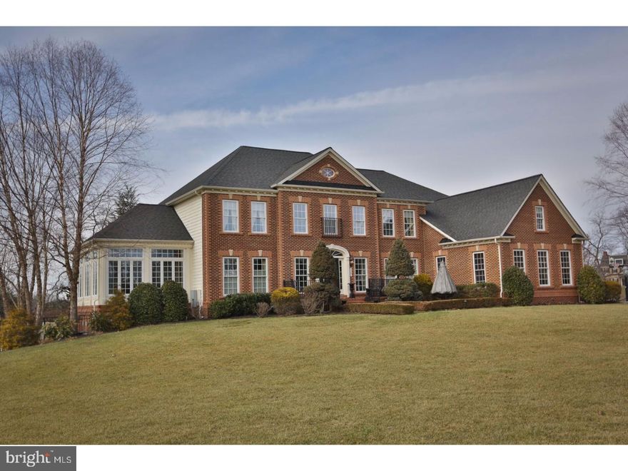 Enjoy a glass of champagne as you soak in the ultimate in luxury living, the finest high-end finishes, and hundreds of thousands in upgrades. Freshly re-painted with modern, neutral tones. Magnificent estate home located on breathtaking corner lot across from sweeping views of farmland, sitting on 2 acres in bucolic Chester County. This home has every feature a sophisticated buyer is seeking. As you approach the entrance into this 5 bedroom, 5.5 bath, 7770 square foot estate, step into the dramatic foyer with fluted main staircase. Meticulous custom painting, trim work, and ceiling design throughout. Brazilian cherry floors gleam throughout, and dramatic soaring ceilings and windows provide breathtaking views to the meticulous landscape beyond. No expense has been spared in the upgrading of this home, as you will see as you enter the kitchen with restaurant grade appliances, granite counters, and extended island space. You will also find a light filled conservatory that functions beautifully as a music room or sunroom. Additionally you will find a cherry paneled study where you will be ensconced in the warmth of rich wood tones and a private entrance to the patio. Upstairs you will find your master suite. Finished with the utmost attention to detail, this grand suite offers tray ceilings and a sumptuous bath, as well as generous custom his and hers closets. The daylight, walkout lower level is finished with a great room with fireplace, media area, custom bar, home gym, and additional bedroom and bath. Enjoy the majestic views from your multi-level outdoor space with custom EP Henry patio, as well as an expansive deck overlooking the beautiful landscape with irrigation system. This home is the epitome of luxury and has many more amenities to list. Available to private showings only. Please see full list of amenities on Trend.