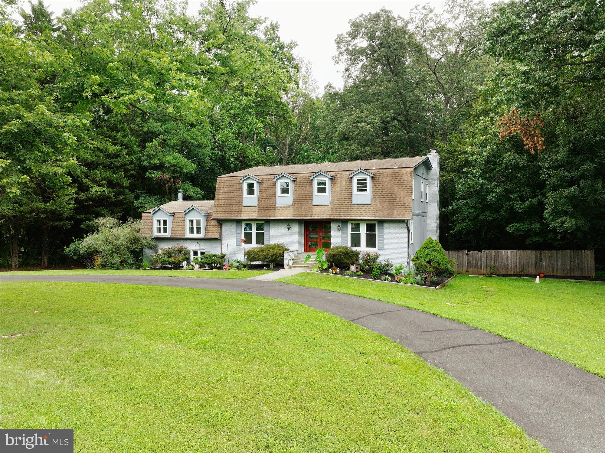 Welcome to your new home. Come check out this exceptional house that features over 5,500SF of living space with 5 large bedrooms, 4 ½ bathrooms, and 3 separate areas with travertine wood burning fireplaces to gather and entertain your friends and family.
The main level has hardwood floors throughout, Living Room, Dining Room, newly renovated chef’s kitchen with solid surface counters and ceramic backsplash, an eat in area, custom walk in pantry, welcoming family room and separate office that can double as a bedroom. The rear decks are accessible from both the family and living rooms.
The walk out basement has plenty of space for entertaining, with a large gathering space, an additional room (currently being used as a guest room with attached full bathroom), a built-in wet bar, and a substantial wine storage area under the stairs.
As you head upstairs you will find 2 spacious bedrooms with ensuite bathrooms, 2 additional bedrooms, and a third bathroom. The primary bedroom has a spa-like bathroom with a huge shower area and soaking tub and the spacious walk-in closet is a must see. The laundry room is located on this level for convenience and features upper and lower cabinets, a sink, and marble counters.
Once outside, step into multiple outdoor areas. Off the main level family room you will find an inviting entertaining area with ample room for seating and grilling. As you venture down the stairs, you are greeted with a concrete patio space and separate fire pit area. Which then brings you to the large kidney shaped in ground gunite pool surrounded by areas for seating, tables, chairs, and loungers. There is also a large lounge area located under the upper deck. The house has a half circular driveway and garage that can hold up to three cars. This beautiful home is a must see.