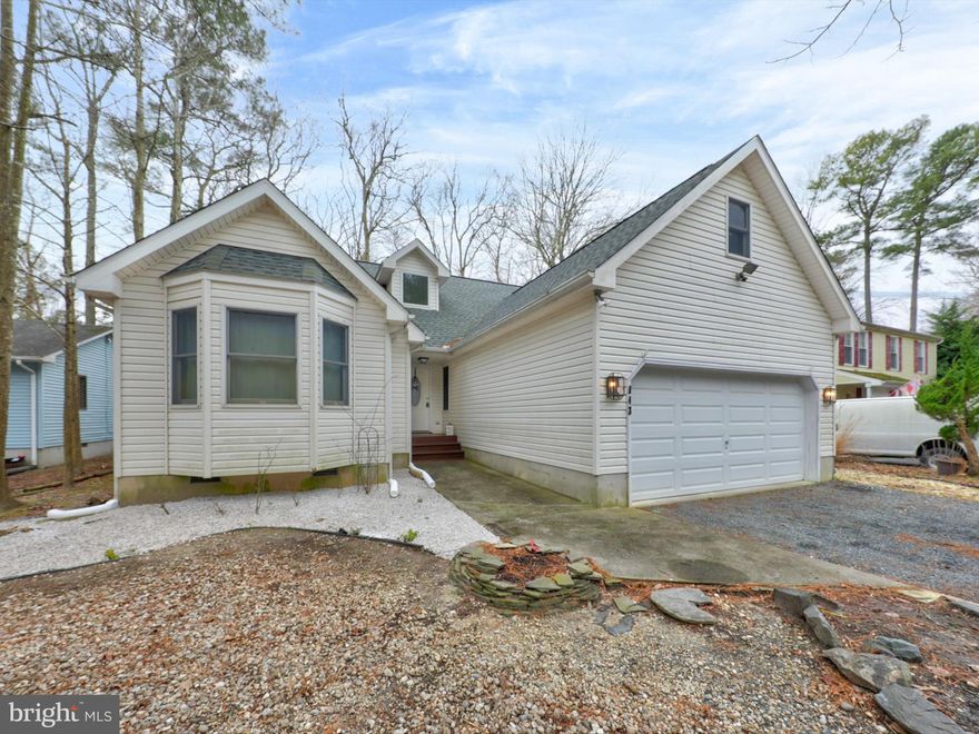 Step into the vibrant Ocean Pines community, where an abundance of amenities await you. This  home boasts over 1400 square feet of  living space. As you cross the threshold, you'll be greeted by an inviting open floor plan adorned with cathedral ceilings. The living room showcases plush new carpet flooring and a cozy gas fireplace, perfect for creating a warm ambiance. The kitchen  offering ample counter and cabinet space to accommodate all your culinary needs. The master suite is exceptionally spacious, providing a serene retreat for relaxation, while the two additional bedrooms and full bath are thoughtfully positioned away from the master, ensuring privacy for all. Step outside and discover the oversized screened porch, a where you can unwind and soak in the beauty of nature.   *Home Inspection has been completed. *Roof is only 2 years old