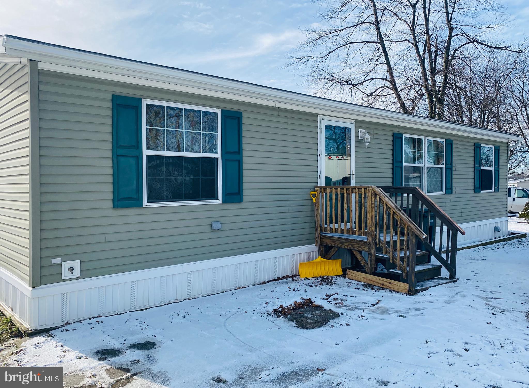 Spacious home with 3 beds, 2 baths. Large open area with living room leading into the kitchen with an island and eat in area. New flooring in the kitchen and laundry. Home is turn-key and ready for a quick settlement. Lot rent is $440 a month, which includes trash, septic, maintenance of the common area, and snow removal for the road leading to the homes. Home owner is responsible for water, tv, internet, electric, and propane. Water is billed every 3 months, $105.00 for the first 8,000 gallons of use.