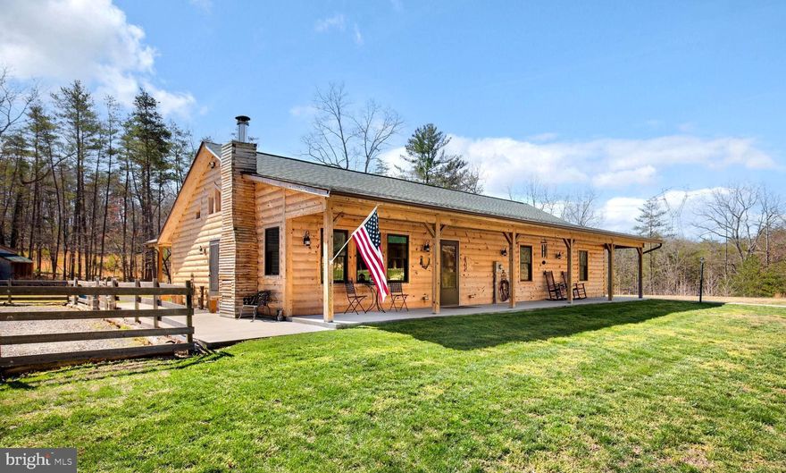 MOTIVATED SELLER $25K PRICE IMPROVEMENT!! Welcome to your WV Retreat!  This property offers 2 custom built log homes on 5 acres.  The main house boasts an open floor plan with 3 bedrooms, 2 full baths, an amazing open kitchen/great room with vaulted ceilings that allows plenty of natural light. The wide hallways and doors allow for ADA needs in both homes.  Extensive hardscaping, multiple covered porches and huge patio offer extensive room for outdoor entertaining.  No expense was spared on the 2nd home.  As you walk up the lighted walkway you will notice this home mimics the main house in every way.   From the Large covered porch to open floor plan and custom details throughout.  This home boasts an additional 1 bed and 1 full bath.   There are approximately 3 acres of the 5 acres that are already fenced and ready for your animals. The seller thought of everything by creating plenty of parking for you and your guests. These 2 homes situated near the quaint town of Capon Bridge and a short drive to many outdoor amenities would make a perfect full-time residence or an amazing 2nd home.  Ritter Hidden Valley Community offers a private lake with beach, playground and tennis courts for your enjoyment. The short-term rental possibilities are endless for the investor in you.