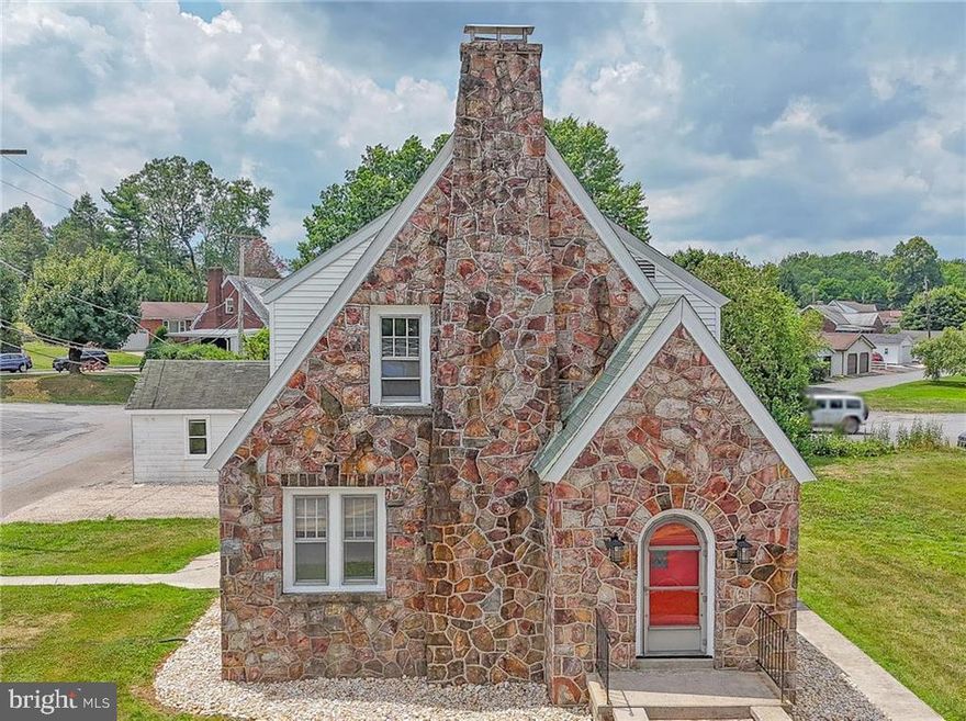 Charming stone cottage sits on a generous lot with much to offer inside and out! The all-stone façade with its distinctive roof lines offers a striking silhouette. Entry is gained from three points on the main level, the front arched door leads to a dedicated foyer with convenient coat closet and leads into the home’s spacious living room with its lovely staircase and stone surround fireplace. An arch allows for easy flow into the formal dining room with a corner China cabinet, as well as double French door access to the home’s four-season sun porch and its access to the side yard. The home’s kitchen is reached via a side entry hall or through a double-hung French door into the dining room and offers an updated and attractive cooking experience! Upstairs are three lovely bedrooms with hardwood floors and original wood trim as well as the home’s full bathroom. Attic access via pull-down offers nearly 300sf of storage space. The lower level houses the home’s utilities and laundry hook-ups. Lawns surround the home on three sides with a two-car parking pad and two-door, two car garage which offers the bonus of a lovely covered concrete patio with exterior fireplace ideal for a barbecue! The location situates you near multiple shopping and dining opportunities, as well as the town of Tamaqua and sits at the mid-point between the Greater Lehigh Valley and the Scranton-Wilkes Barre area! Bonus: Tamaqua graduates qualify for the two-year LCCC Scholarship!