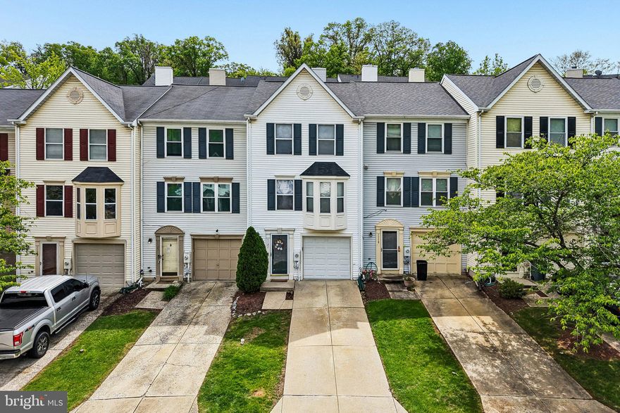 Freshly updated and move-in ready, this beautiful townhome in River Chase offers the perfect blend of comfort, style, and low-maintenance living! Featuring approximately 1,734 square feet across three finished levels, this home includes two spacious primary suites, each with its own attached bath, plus an additional half bath for guests. The bright white kitchen is designed to impress with granite countertops, stainless steel appliances, hardwood floors, generous cabinet space, and a huge pantry! The open-concept main level flows seamlessly into the dining and living areas, highlighted by a cozy wood-burning fireplace and abundant natural light, including a charming bay window. Step outside to enjoy the brand-new deck, ideal for entertaining or relaxing outdoors. Fresh paint throughout gives the home a crisp, modern feel, while the newer roof adds peace of mind. Additional features include vaulted ceilings, a finished lower level offering flexible living space, attached one-car garage, and ample storage. Conveniently located near major commuter routes, shopping, dining, and everyday amenities, this updated home offers exceptional value in a sought-after community. Condo fee includes lawn maintenance and roof!