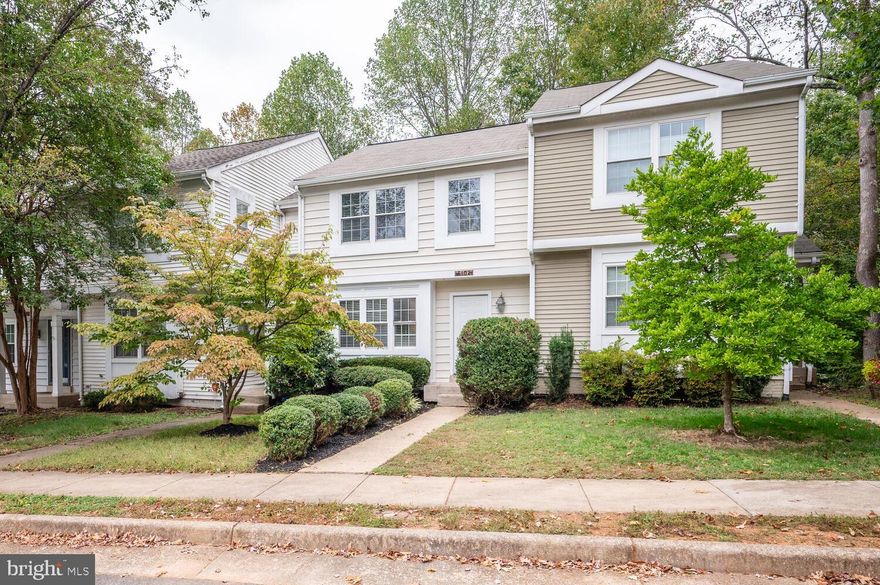 Welcome to this stunning three-level townhome offering modern updates, stylish finishes, and a prime location within the sought-after Montclair community. This move-in ready home features a spacious and versatile layout perfect for comfortable living and entertaining.  The updated kitchen is a true highlight, showcasing granite countertops, stainless steel appliances, maple cabinetry, and a classic tile backsplash. Enjoy brand new LVP flooring that extends through the foyer, kitchen, upper level, and lower level, complemented by fresh designer paint throughout the home.  The living room features gleaming hardwood floors, a wood-burning fireplace, and direct access to a spacious deck backing to private wooded views—ideal for morning coffee or evening gatherings.  Upstairs, you’ll find three generously sized bedrooms, including a primary suite with a walk-in closet and an updated en-suite bath. Two additional bedrooms share a refreshed hall bath with a new tub and ceramic tile shower surround.  The fully finished lower level offers incredible flexibility, complete with new flooring, recessed lighting, a large recreation room, and a separate flex room—perfect for a home office, gym, or media room—plus a third full bath. The walkout basement fills the space with natural light and leads to a stone paver patio and fully fenced backyard, creating the perfect spot for outdoor relaxation.   Additional upgrades include a newer HVAC system and water heater (both replaced within the last 5 years), along with two assigned parking spaces for convenience.  Residents of Montclair enjoy access to incredible community amenities including three private beaches, playgrounds, covered pavilions, picnic areas, basketball and volleyball courts, fishing piers, sports fields, a dog park, and an amphitheater overlooking the lake.  This beautifully updated townhome combines comfort, style, and an unbeatable location — all in one of Northern Virginia’s most desirable lake communities. Don’t miss your chance to call it home!