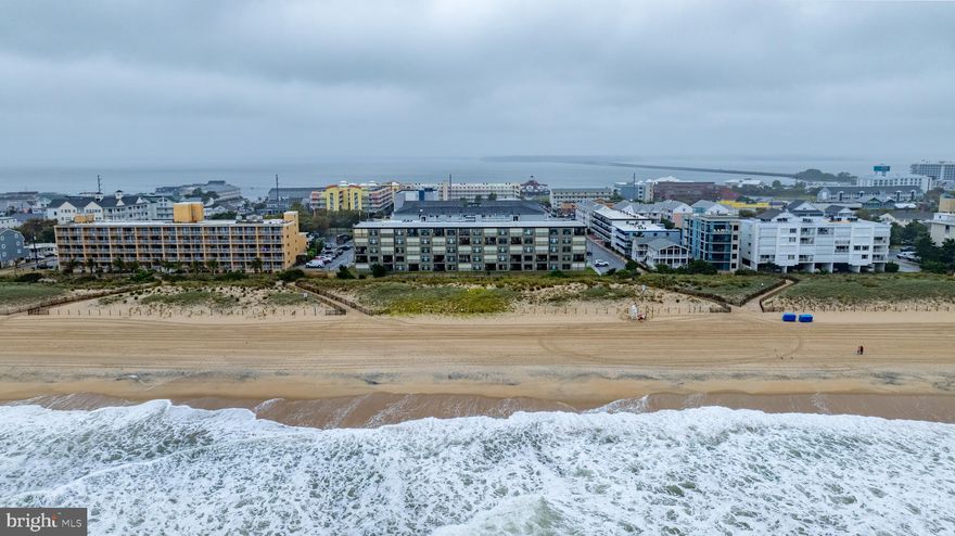 Welcome to Ocean Trail Condominiums, perfectly located in the heart of Midtown Ocean City. This completely furnished spacious  2BR, 2BA  first-floor condo combines comfort, convenience, and coastal charm--all just steps from the Beach.
Inside, you’ll discover a spacious primary open-concept living and dining area that flows seamlessly to a private balcony, ideal for enjoying your morning coffee and listening to the soothing sounds of the Ocean.
 The updated Kitchen features new stainless steel appliances, granite countertops, stylish cabinetry, and an all-in-one washer/dryer combo.  The large primary suite boasts its own private bath, while the second bedroom offers plenty of room for family and guest.
Additional highlights include elevator access, 2 assigned parking spaces, faux wood blinds and an outdoor shower for rinsing off after a day in the sand. 
With a prime midtown location near the Ocean City Convention Center, Seacrets, top restaurants, shopping and entertainment , this condo is perfectly suited as a full-time residence, vacation retreat or lucrative rental investment. Come and experience the ideal blend of relaxation, convenience and coastal living at Ocean Trail Condominiums.