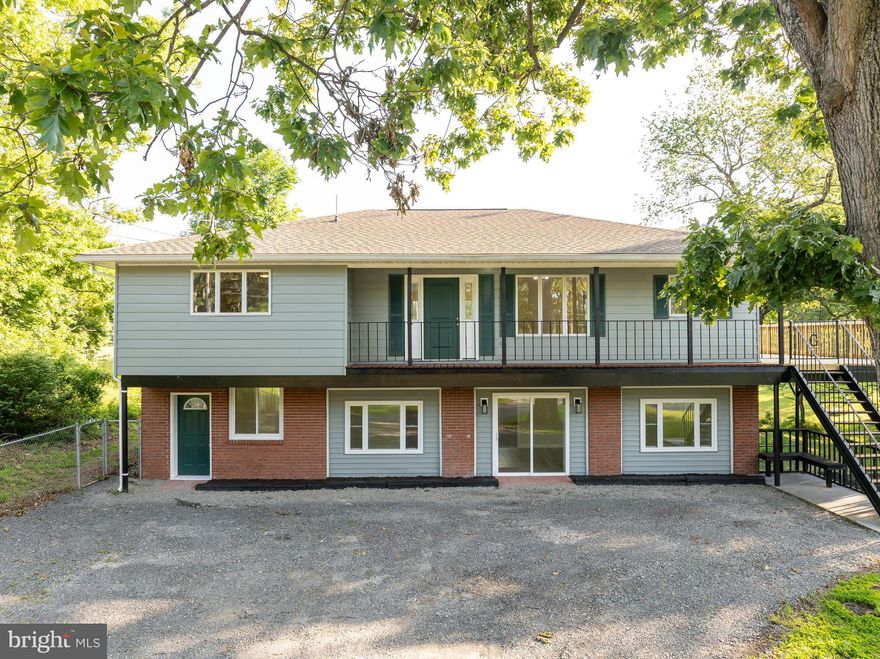 This 5 bedroom, 3 bath home has been completely renovated and is ready for your large or multigenerational family! Or add a kitchen on the lower level and rent it out! This beautiful home sits on 1.24 UNRESTRICTED acres. NO HOA! The large gravel driveway provides plenty of parking.  The main level features an open floor plan. As you enter from the covered front porch into the spacious living room, offering luxury vinyl plank (LVP) flooring, recessed lighting, and dual ceiling fans. This room is bathed in natural light from multiple windows. The living room is open to your dining room and kitchen. This is a great set up for entertaining! The LVP floors carry into the dining room. A decorative light fixture clearly defines the space. Beyond the dining room you have the gorgeous kitchen, featuring classic, white shaker cabinets, granite countertops, and ceramic tile backsplash. All appliances are stainless steel. The large center island provides breakfast bar seating for 4 in addition to extra meal prep and storage space. You have direct deck access from your kitchen through the side door. The laundry room with LVP and white shaker cabinets keeps machines nicely tucked away. The main level features three generously sized bedrooms with carpet, closets, and ceiling fans. Hall bathroom features LVP, single bowl shaker vanity, and tub/shower. The primary suite is immaculate, featuring carpet and a ceiling fan. You have a private ensuite bathroom with LVP floors, tub/shower, and extended shaker vanity. Your suite is completed by a large walk-in closet for tons of storage space. The lower level of the home features a large mudroom with LVP, recessed lighting and guest closet. To your right you have a huge family room, featuring LVP floors, ceiling fan, and recessed lighting. Sliding glass door leads out to gravel driveway. This space would be great for gathering with friends and family. Beyond you'll find  bedrooms 4 and 5 with carpet, closets, and ceiling fans. The lower level full bath features LVP, single bowl shaker vanity, and tub/shower. There is also an office/den on this level that would be great for work from home or a guest room. The basement of the property features a huge 30 x 50 (six car) garage space with access from the lower driveway. In addition to the garage space, there are several other potential uses down here. The concrete floors would make it great for a home gym, bring your weights! It would also make a great workshop, even for your project cars. Make it whatever you need! Outside the home you have a HUGE deck off of the main level. This is the perfect space for hosting BBQs or just enjoying the stunning mountain views. The rear yard is level and lush with grass. Mature trees provide ample privacy. This space is ready for your pups with the added bonus of allowing the chickens you've been wanting! This home has the room you need for your family AND NO HOA! Schedule your showing today!