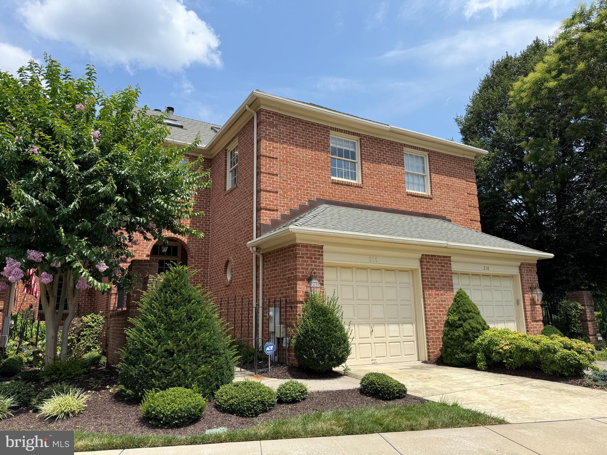 Prepare to be impressed with this stunning home! Absolutely gorgeous and rarely available Mediterranean style full brick villa home with attached garage in highly sought after community of Wellington Woods. Enter the wrought iron gated entrance to a private brick lined path leading to quaint covered brick porch. Cozy entrance foyer with ceramic tile flooring. Oversized large windows allow an abundance of natural light. Convenient powder room with ceramic tile flooring. Sunken living room features hardwood floors and fireplace with decorative mantel. Contemporary , open concept layout includes a kitchen which opens to dining room with gorgeous huge windows, and deck overlooking private backyard, which backs to woods. Beautiful kitchen with light cabinetry, granite countertops and backsplash, fusion travertine flooring, and stainless steel appliances. Upper level features primary suite with spacious primary bedroom with bumpout, walk in closet and spa like primary bathroom with jacuzzi tub, stand up shower, dual sink vanity and ceramic tile flooring. There are also two additional large bedrooms, second full bathroom, and laundry room. Additional staircase leads to huge loft area with 3 skylights with UV protection and shades. The loft can be used as an additional bedroom, office, den, playroom or home gym. Fully finished walkout basement offers in law suite potential with a full bathroom. Lower level includes a huge recreation room with beautiful windows, built in wet bar, second fireplace, recessed lighting, ceiling fan and exit to spacious patio and backyard retreat. Bonus storage room can be used as a workshop. Hardwood floors throughout the entire home. Poured concrete soundproof walls. Gutter guards on front and back of home with heated rear gutters to prevent freezing. Enjoy the convenience of living in the heart of Bel Air, within walking distance to shopping, restaurants, and the Ma and Pa Trail. Lawn, roof, and exterior siding/paint are included in the HOA dues. Don't miss out on your opportunity to make this rare gem your home!