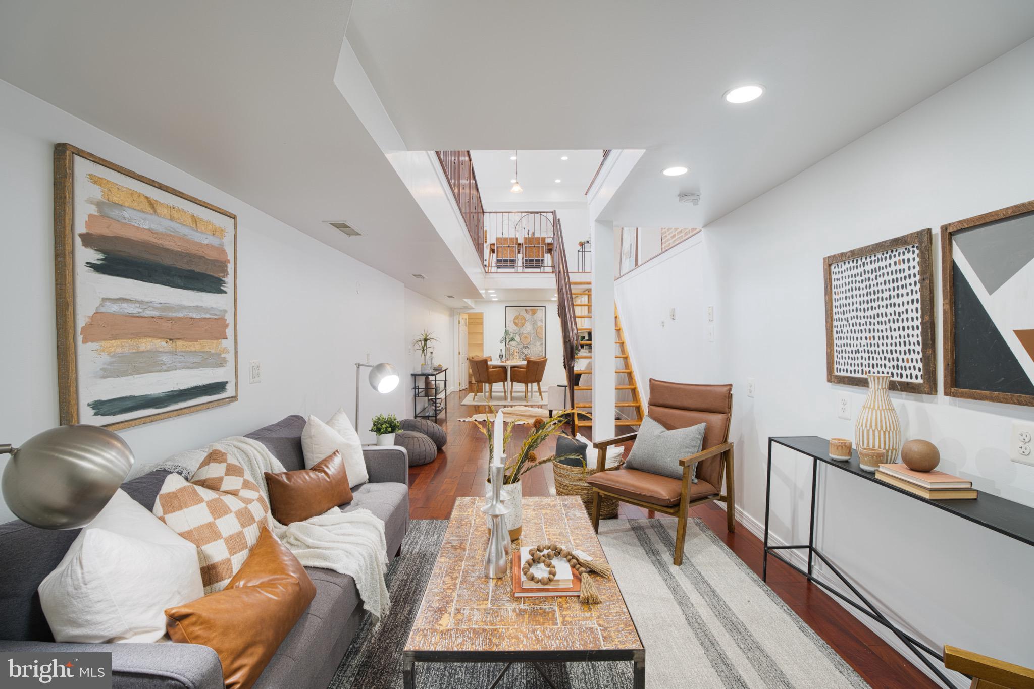 Light-filled and full of character, this updated 3-bedroom end-of-group rowhome in Canton offers a unique open layout and unbeatable location just steps from Patterson Park. The main level boasts hardwood floors, exposed brick, and a striking open-concept design with floating staircase and iron railings that connect seamlessly to the finished lower level.
Upstairs, you'll find three bright bedrooms, a spacious full bath, and convenient second-level laundry hookups. The main level features open living and dining spaces flooded with natural light, and the lower level adds flexibility with a cozy second living area, a half bath, and room to add a shower or tub for a future full bath conversion.
The kitchen area is ready for your design vision. Fresh finishes, large windows, and thoughtful architectural touches make this home a standout.
Perfectly located near the park, restaurants, and all the charm Canton has to offer—this is a one-of-a-kind opportunity with room to grow.