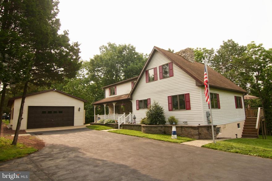 If you have wanted a front porch to sit and relax on, then 132 E. Park Ave. has that, and so much  more! 3 Large Bedrooms, 2.5 Baths, 2 Car              Detached Garage, Over 2.5 acres of privacy!!      Plenty of Room for Parking, Plenty of Room for a Pool, Plenty of Room to Grow!!  Main Floor has a  Large Living Room with a whole wall full of          windows,   a 2 story Fireplace, Exposed Wooden Beams and an  outside Deck.  Kitchen and Dining  areas  are open and convenient. Master Bedroom is on the main level and  offers a private sitting    area.  2nd  floor has 2 more bedrooms, Full Bath  and a Long  Hallway  that looks down on the open       Living  Room. Finished Basement offers a  Bar,    Wood Burning  Stove and  Sliders out to a  patio.  Basement also has its own  Half Bath, Laundry     Area and Storage Room.  You   may have started  out wanting a  Front Porch, But you could  end up   with  your Forever Home!!