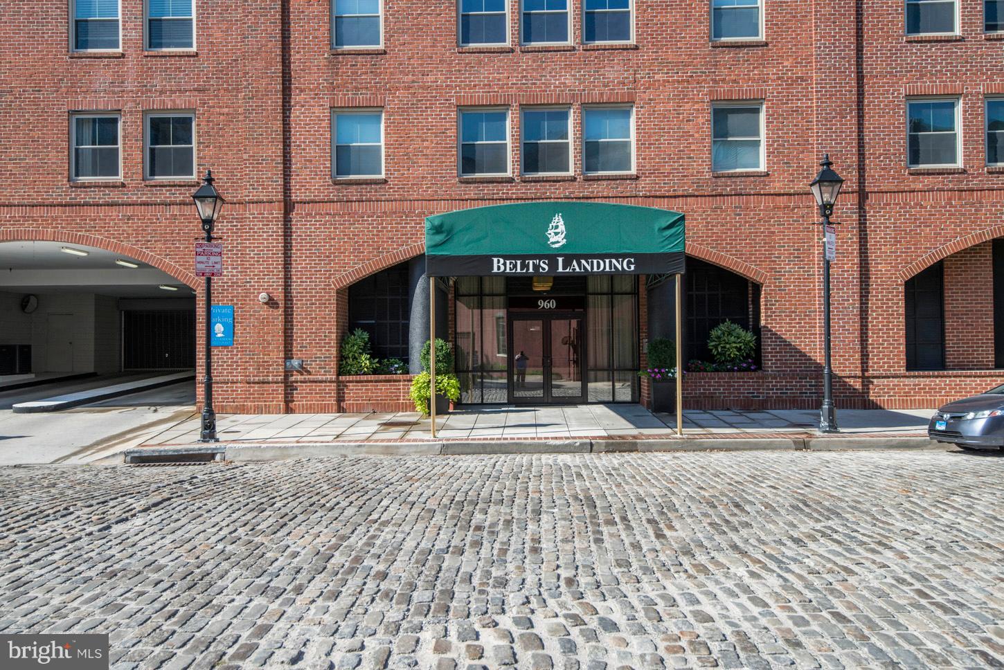 Wonderful Waterview unit in the Fell's Point Historic District!! All of the most sought after features of city life-Garage Parking up to 2 spaces, 24 Concierge & Security, Fitness Center, Harborside Pool & Spa plus a private Marina. The unit is perfect too with its New Kitchen, Wood Floors, En Suite Bedroom with its Double Closets and Full Bath with Double Vanity. There's a new, stackable Washer/Dryer too. Enjoy the Wrap Around Balcony that runs from the living room to the bedroom. 12' & 6' Patio Doors lead to the balcony where your outdoor furniture will add even more living space. Belt's Landing is the hidden gem of Fell's Point. It is located on the historic cobblestone, no through street and on the waterfront. You'll live in a Quiet, Picturesque escape from the famous port neightborhood. Park your car in the garage and enjoy your new home.