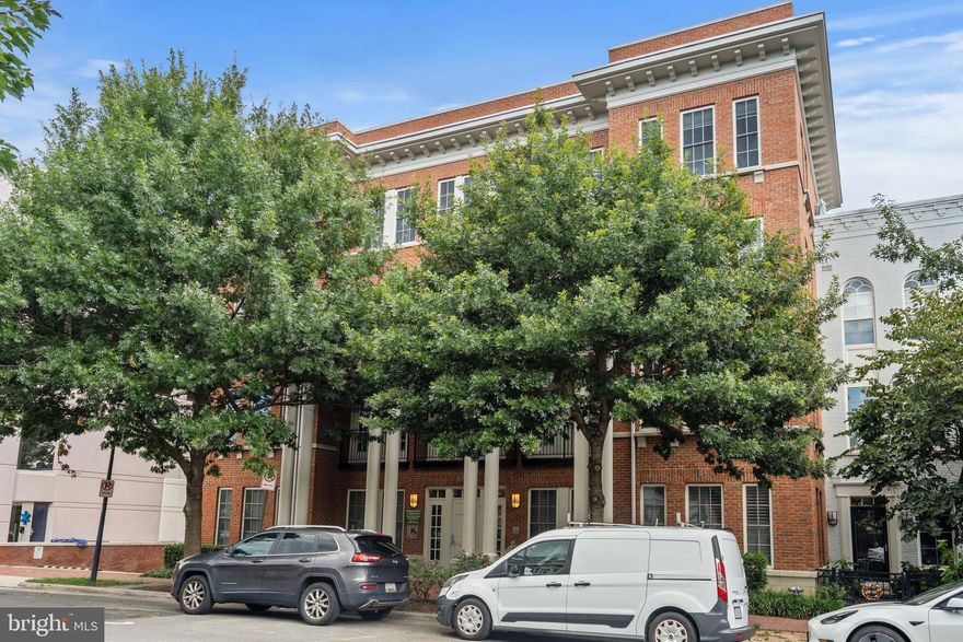 You CAN have it all in this beautiful Northeast Old Town condo! The exceptional location offers the perfect  in-town living experience!  Brimming with convenience and charm -  Fun shops, popular restaurants, parks, exercise options, and weekly farmers markets.  Two blocks to the scenic Potomac River and great bike and walking trails.    TWO lights to Reagan Airport and DC plus easy access to public transportation.    As a primary residence or a second home, you will love the style and convenience of this sensational condo!  Special features include:  an open  kitchen with a large island for morning coffee; handsome cherry cabinets; gleaming granite counters;  and the chef's  preferred choice --gas cooking!  
The open floor plan provides easy living and entertaining space. Oversized windows welcome abundant sunshine!   A French door and  Juliette balcony. open to fresh air and a cool breeze,  Check the outdoor temperature before leaving home and catch the "sliver of the river" view!  Tranquil Primary Suite - Dream  sweet dreams in a king-sized bed. The attached bath exudes comfort and luxury with a new walk-in shower featuring marbleized ceramic tile, a bench, and a nook for necessities. Easily organize your morning "get-away" with the customized built-ins in the walk-in closet.                                                                                                          A corner bedroom with great  windows and neutral carpet can easily serve as a sunny, pleasant  home office.  And a second bath shines with neutral ceramic tile,  a tub-shower and  attractive vanity  - perfect for family or guests .   Adding value and convenience are  hardwood floors, generous closets, in-unit laundry, proximity to the elevator and  TWO secure, assigned  garage parking spaces . ( G216 and G220). Communal amenities include a roof top deck, charming courtyard and fountain,  guest parking, and bike storage. .  Pristine! Move-in ready!  Check all the boxes on your list,  move in, LOVE YOUR NEW HOME and wonder, "Why didn't I do this sooner????"