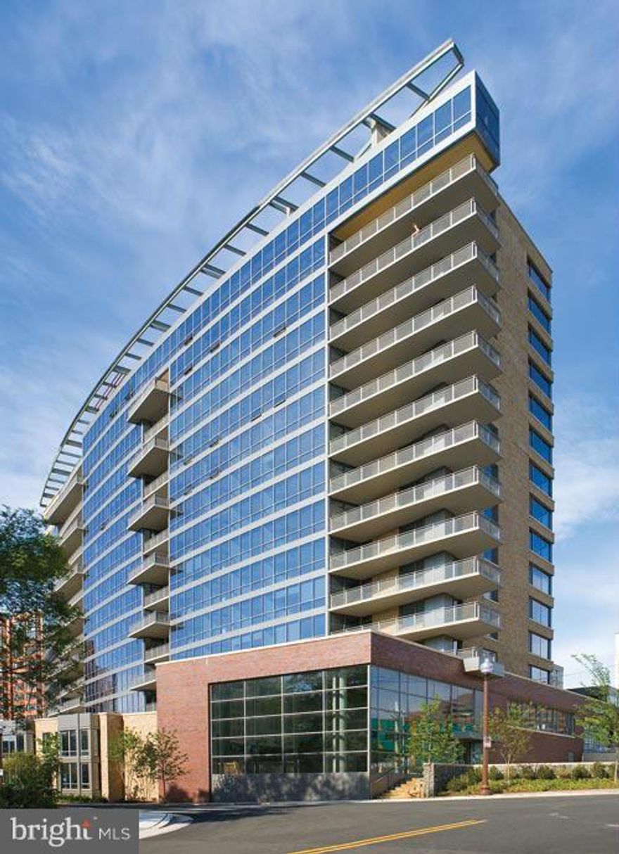 Prime location! Walk->Metro, restaurants, etc. Bright & spacious w/ open floor plan & wd flrs. Kit w/ granite c-tops & breakfast bar. Nice view from the living room & BR. Walk-in closet. Garage parking,etc. The building offers great panoramic views of DC & world class amenities; outstanding rooftop terrace, pool, party room, billiard lounge, gym, spa, conf room, 24 hr concierge, etc. FOR RENT TOO!