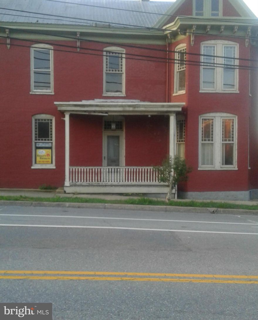 Come live amongst History in this pre-civil war era 1787 built brick and log house.  Located at the top of the hill on West Potomac street in Williamsport it is just a short stroll to the history and beauty of Cushwa basin and the C and O Canal!!!  This 9 room house still maintains many of its original features from the stained slump glass charming windows to the wide plank wood flooring.