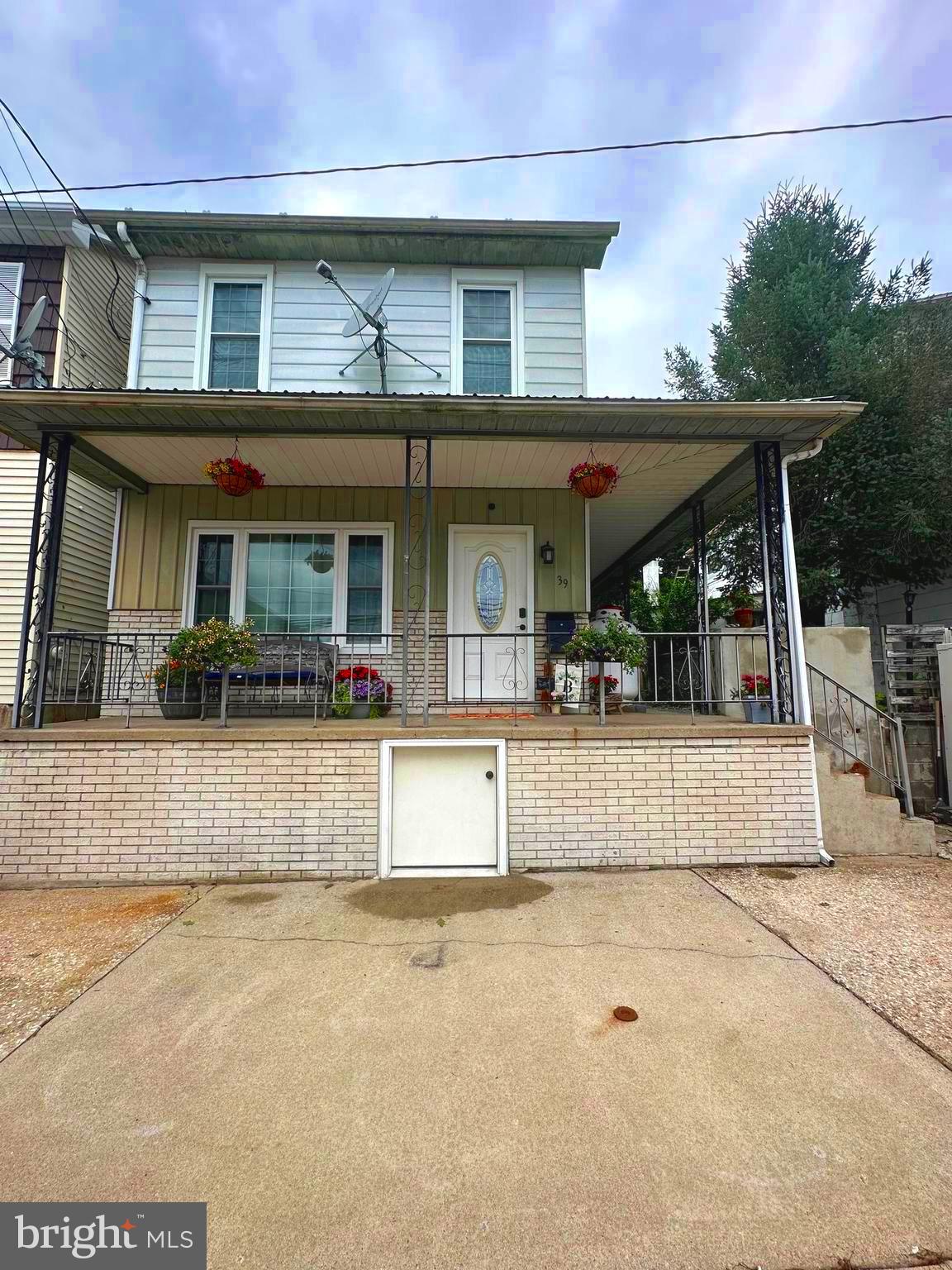 HOME BACK ON THE MARKET DUE TO NO FAULT OF ITS OWN! Are looking for a home you can move right in with no 'Honey to do" list...then look no more! 39 W Grand Ave has 3 bedrooms, two full baths , one on each level, oversized modern kitchen, double living room, large patio with a pergola, shed with new roof! The upgrades are numerous which incudes modern and functional lighting, custom cabinetry, granite countertop, first floor laundry, all new windows, new interior doors, new carpet, patio door, first floor full bathroom, LVP flooring, new heat pump with humidifier, PEX manabloc plumbing system, upgraded electrical, new basement door, concrete patio, the attic bedroom is READY FOR ITS NEW OWNERS, a new addition to rear of home to enlarge the kitchen and add a full bathroom, primary bedroom has a recessed electric fireplace built into a veneer stone wall unit which will also house a large screen tv and barndoors on the closet and entry door. Oh did I mention the kitchen? The kitchen is absolutely amazing, a cook's dream, it even has a pot filler! The countertops and paint color scheme is beautiful along with the gorgeous custom cabinetry. You definitely have space to entertain in your double living room, oversized kitchen and patio complete with a pergola. Plan your parties now !!