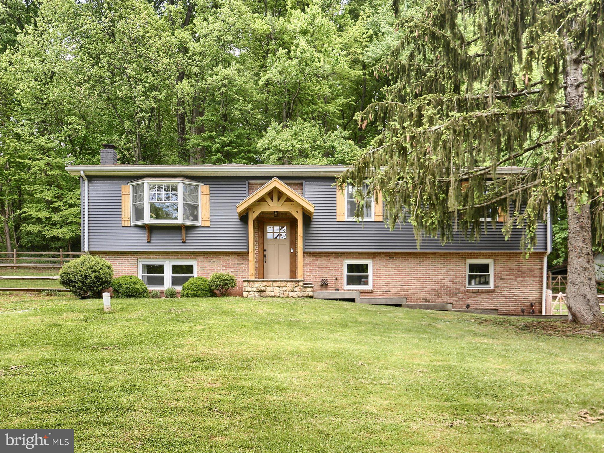 Truly Magnificent 3 bedroom, 2 full bath,  Bi-Level home on over 3 acres in Owen J Roberts School District of East Coventry Township. The spacious front living room features a bay window over looking the enormous yard. Seamlessly connected to the dining area and kitchen with solid wood counters and super functional pull out drawers, recessed lighting, propane cooking, all stainless steel appliances, and ceramic tile floors. The expansive sunroom addition boasts walls of windows, a warming propane fireplace, and a door leading to a large private composite deck and a fully fenced back yard - perfect for indoor-outdoor entertaining. The spacious primary suite is complete with a walk-in closet that leads to a full bath. Two additional large bedrooms and a hall bath complete the main floor. The lower level offers even more living space, featuring a cozy wood fireplace and brick hearth, a laundry room, a large pantry, and an exit to the attached two-car garage. Outside you will find a very large workshop and an additional shed for storage. Roof is less than 10 years old. New well water pressure tank (2020). New water filtration system with UV, sediment, and carbon filters (2022). All new kitchen, including appliances (2021). New hall bath (2021). New primary bath (2021). All new flooring (2020). New fencing (2020). New front porch (2023). This home offers a short commute to King of Prussia and Plymouth Meeting, with easy access to major highways (422, 202, 476, & 724).  Schedule immediately!