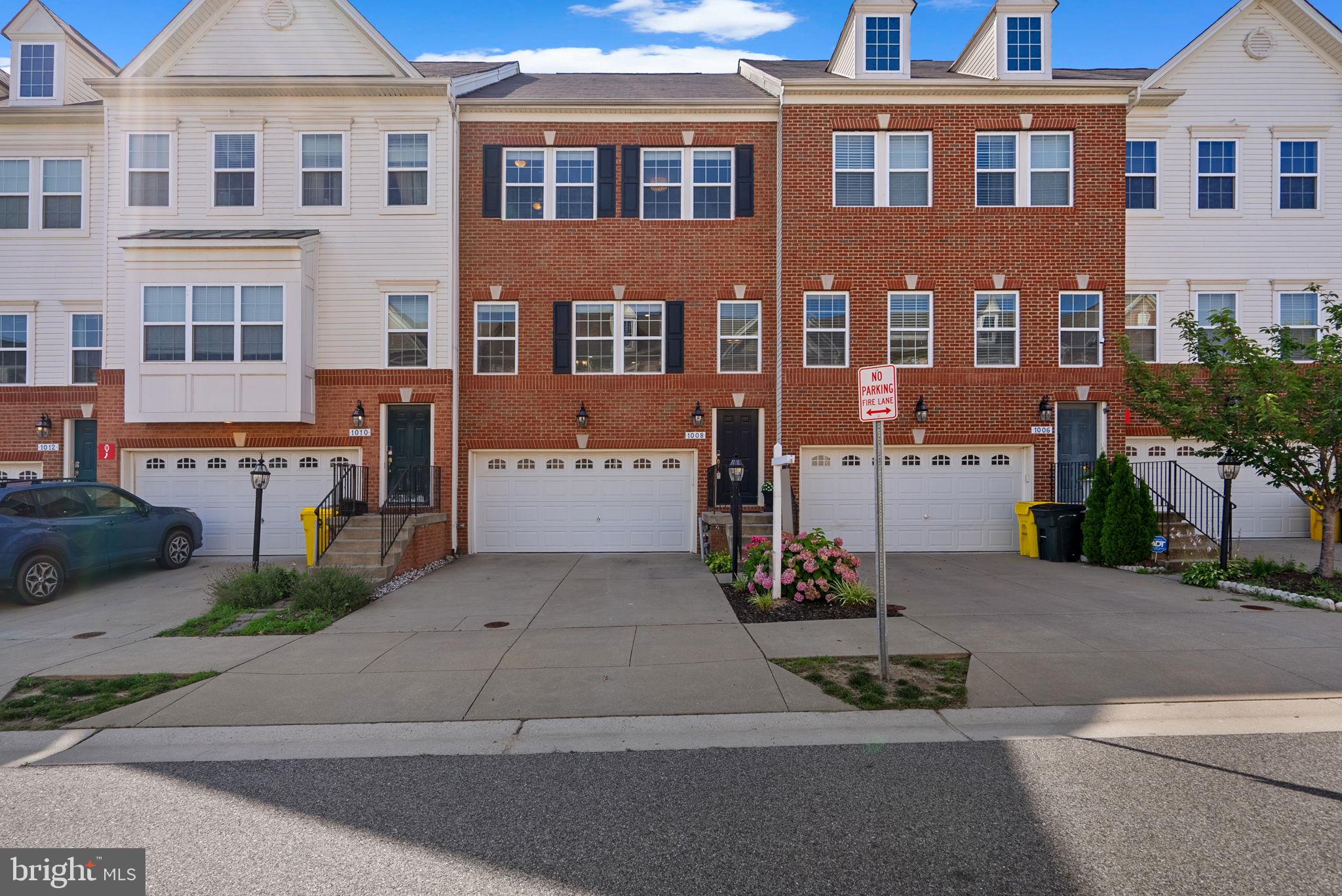 Contemporary townhouse offering 2,583 square feet, 4 bedrooms, 3 full baths, 1 half bath, and a spacious 2-car garage in vibrant Summerfield Village. Welcome to a fantastic home in a welcoming, safe community, perfect for families! This neighborhood offers a strong sense of security and camaraderie, providing peace of mind for everyone. Not only does it boast a friendly atmosphere, but it is also served by some of the best schools in the area, ensuring an exceptional education for your children. Whether you're enjoying a quiet afternoon at home or exploring the local parks, you'll appreciate the convenience of having excellent schools and a thriving, supportive community right at your doorstep.
The welcoming lower level features hardwood floors, a convenient mudroom, a spacious fourth bedroom with its own full bath, and a bright recreation room that opens directly to the backyard. Upstairs, the open-concept main level shines with hardwood floors throughout, a cozy living room with an elegant floating built-in electric fireplace, a dining area, a powder room, and a beautiful eat-in kitchen equipped with stainless steel appliances, a breakfast bar, an island, chic backsplash, crisp white cabinetry, a butler’s pantry, a walk-in pantry, and access to the deck — ideal for everyday meals and entertaining. The upper level includes a laundry area for added convenience, along with three comfortable bedrooms and two full baths. The primary suite is a true retreat with a spacious walk-in closet outfitted with a custom closet system, an ensuite bath with a double vanity, a separate water closet, and a large walk-in shower with a built-in bench. Outside, unwind on the covered patio and take in the gorgeous panoramic sunsets on the deck above. The private backyard backs to a wooded area, an open green space, and a bike trail — the perfect backdrop for outdoor relaxation and recreation.