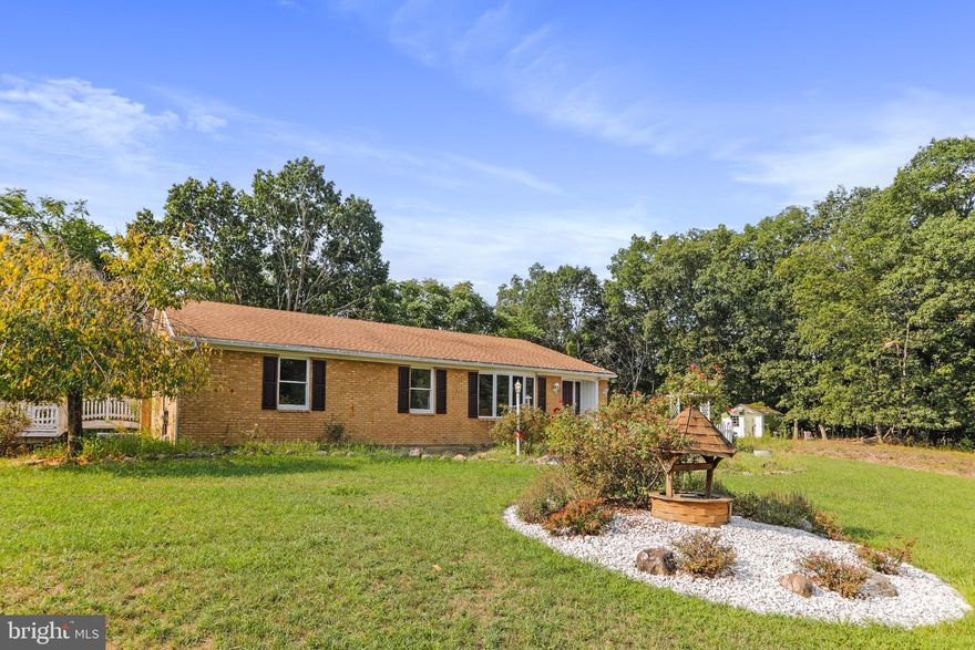 Welcome to 223 Little Creek Lane, located in Berkeley Springs, WV! This lovely rancher, full of charm, 
 offers 3 bedrooms on the main level, formal separate dining room, kitchen with granite counters, cooktop, double wall oven, dining area, large great room, and laundry area. Downstairs, you will find a large rec room, full bathroom with a beautiful walk-in shower, walk in closet, office with a gun vault, and oversized 2 car garage.  Back to the main level - one can access the deck that extends across the entire length of home from the great room or the dining area.  This property sits on 3 unrestricted acres as there is no HOA. There is an above ground pool for these hot summer days.  It needs some TLC or can be removed. There are beautiful perennials, pavers in the front that lead to the bright foyer, and a sweet picket fence.  Private and quiet, yet very close to  War Memorial Hospital, Blue Ridge Community & Technical College, and the lovely town of Berkeley Springs for shopping, restaurants, etc.! Seller is offering a $5000 repair or closing cost credit.  We are aware there is peeling paint on the deck that leads to the above ground pool.   Some of the deck boards are loose.