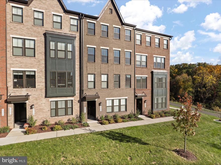 OPEN HOUSES CANCELLED!  OFFER ACCEPTED!  Price reduction for this gorgeous 3 bedroom, 2.5 bath like-new condo townhome with single car garage parking, over 2,500 sqft of upgraded, designer living space and lovely greenspace views. Bright, open main level floorplan anchored by cook's kitchen in the center of it all! Granite counters, tons of Timberlake cabinetry, stainless steel appliances and hood, backsplash, large pantry and 11+ foot island with eat-at seating. Spacious family and dining room; built-in area for in home office and landscape electric fireplace with remote. Luxury vinyl plank tile throughout main level, oak overlay stairs to upper level plus carpet with upgraded padding in all bedrooms. Primary bedroom with large walk in closet; tray ceilings and recessed lighting. Spa-like primary bathroom highlighted by quartz counters and frameless glass enclosed stand shower. 2 spacious bedrooms, 2nd full bath and upper level laundry with additional storage complete upper level.  Tons of smart enabled features wifi-enabled garage control, Ring door camera, house alarm, smoke & carbon dioxide listener plus Flo by Moen Smart Water Valve.  Low-maintenance living with included exterior maintenance, lawn and street care, snow removal plus trash/recycling, water & sewer included in monthly fees.  Impeccable maintained in the 3 short years of ownership.  Additional parking very close-by.  Amenities that exceed expectations!  Jogging/walking trails, recreation center with outdoor swimming pool, pocket parks and tot lots! Walking distance to Ashburn Metro Station (silver line) and close to shopping, restaurants, tons of recreational activities, Dulles International Airport, Loudoun County Greenway and major commuter routes.