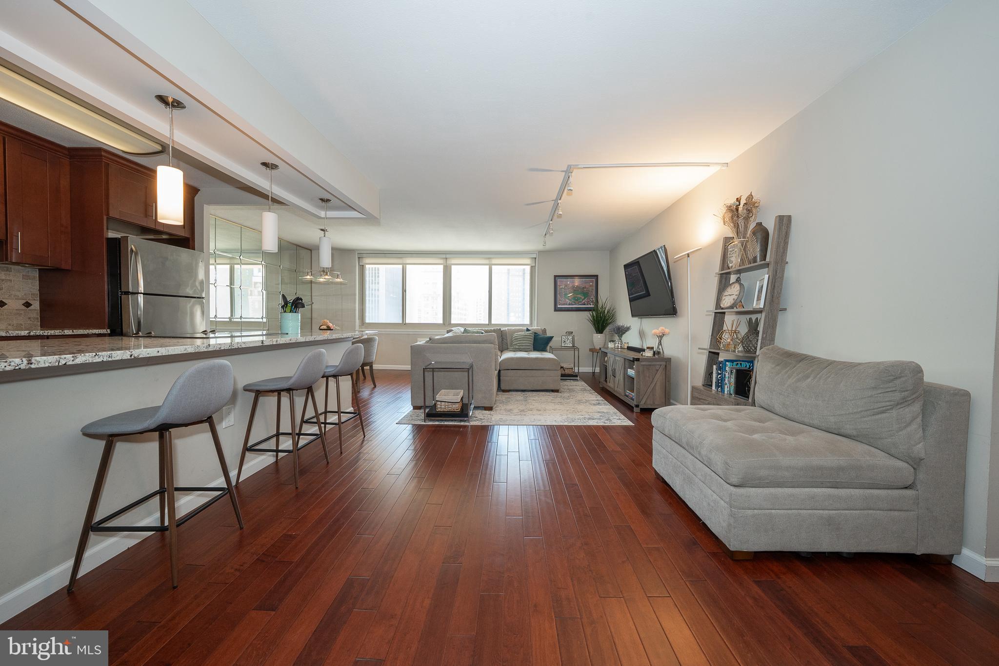 Gorgeous, 2 bedroom, 1 full bathroom south side unit at the William Penn House is a must see! This 1,134 sq ft renovated, 10th floor unit features a fabulous open floorplan and, hardwood floors and upgrades galore. The open kitchen boasts beautiful cherry wood cabinets, tile backsplash, granite countertops, stainless steel appliances and generous breakfast bar. Spacious primary bedroom with walk-in closet. Second bedroom also with ample closet space. Updated bathroom with large walk-in tiled shower and double vanity. Located in desirable Rittenhouse House Square. This building features 24-hour Security and Doorman, On-Site Management and Maintenance, Rooftop Pool with amazing views of the city. On premise VALET Parking available for 100 per month for one car. THE MONTHLY FEE INCLUDES ALMOST EVERYTHING: All Utilities including electric, heat, air conditioning, water & basic cable, All Real Estate Taxes & Maintenance Package. This unit has an abundance of closet space, newer windows in unit! Washer & dryer in unit! This spectacular building has NEVER HAD AN ASSESSMENT! Nominal real estate transfer tax & no title insurance required. Experience the ability to walk out your door to first class, 4-star restaurants, fabulous shopping & all the conveniences of this sought after neighborhood. Walk score is a 98! One time admin fee paid at closing.