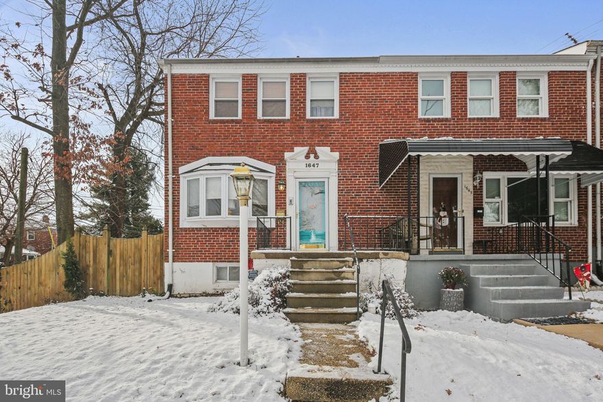 Welcome to 1647 Walterswood Road, a truly rare find in Baltimore’s Ramblewood neighborhood. This end-of-group townhome offers something you almost never see: a fully fenced large backyard AND a detached two-car garage.
The artistic touch is felt from the backyard with the mural on the garage and painted fence to the bright, cheerful colors inside! The sun-drenched main level features a kitchen with direct outdoor access, stainless steel appliances, and an open flow to the dining and living areas. As an end unit, the extra windows fill the home with natural light. The classic bow window in the living room adds warmth and charm, creating the perfect cozy space.
Upstairs, you’ll find 3 nicely sized bedrooms, including 2 with additional windows, plus a full bathroom. The finished basement offers exceptional versatility, featuring a dedicated laundry room with ample storage, a second full bathroom, and a bonus room ideal for a home office, gym, craft space, guest room, or game room.
Conveniently located just minutes from major commuter routes, Mt. Pleasant ice rink and golf course, shopping, restaurants, and hospitals, this charming home truly has it all and is ready to be yours!