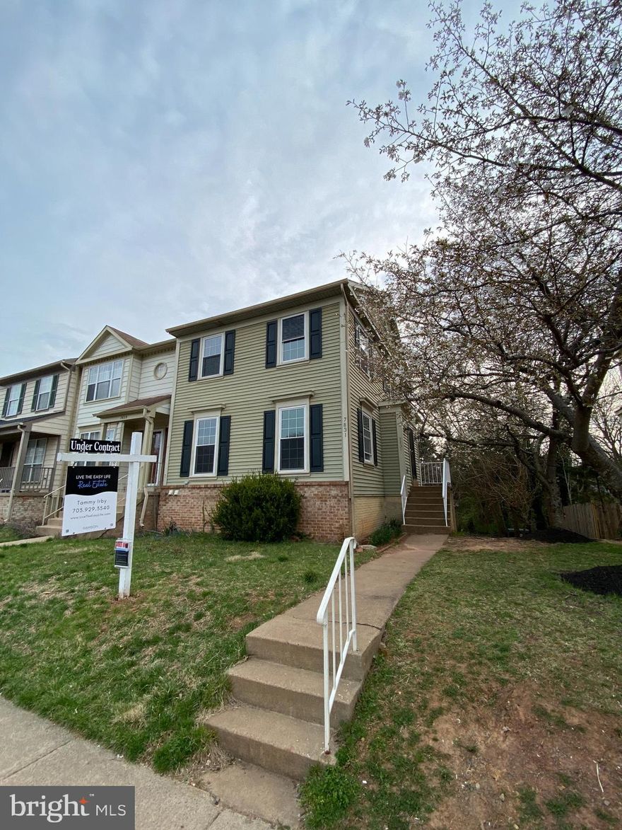 Location! Location! This rarely available large end unit townhome is undergoing the finishing touches on numerous upgrades for its new owners. Enjoy 3 level living with a timeless floor plan including 4 bedrooms and 3.5 baths. Cook your favorite meals in the updated kitchen with freshly refinished white cabinets, granite countertops and backsplash, stainless steel appliances (gas cooking on the stove), and table space for casual dining. New gleaming wood floors through the foyer, hallway and kitchen also! Relax and entertain in the spacious living room, and gather with friends and family in the formal dining room for special meals. Retire to the owner's suite with double closets and attached private bath for some R&R. The upper level features two additional nicely sized bedrooms and a hall bath. Step down into the finished basement to enjoy family time in the large recreation room/4th bedroom (your choice) with brand new additional full bath. This space is perfect for a home theater, play room, guest space, or a home office or large 4th bedroom. Walk out through the sliding glass door and enjoy some time outdoors in the backyard that backs to mature trees.