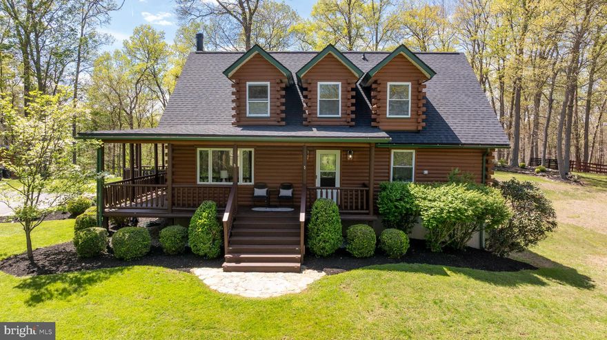 Welcome to a truly unique special log cabin retreat nestled on 9.29 acres in the heart of the Baltimore County's Hereford zone in Parkton. Surrounded by rolling countryside and breathtaking views, this one of a kind property offers the perfect blend of rustic charm, privacy and timeless appeal. 
This beautifully maintained log home consisting of 4 beds, 3.5 baths and features warm wood finishes with a layout designed for both everyday comfort and entertaining. A stunning wraparound porch invites you to relax and take in the peaceful setting, while the expansive stone patio and outdoor living areas create the perfect backdrop for gatherings.
Equestrian enthusiasts and nature lovers will appreciate the open acreage to enjoy a horse friendly setting barbequing, hiking, four wheeling, and hunting.  Whether your seeking a private retreat on top on the hillside, hobby farm or a full time residence with character and land, this property delivers. The location is just minutes away from major routes and conveniences and close to the NCR trails. Updates include a NEW ROOF,  WELL PUMP,  WATER HEATER and a NEW OIL TANK . Big Bonus WHOLE HOUSE GENERATOR!
Experience the beauty, tranquility and lifestyle that only a unique  property like this can offer. Come take a look and make your appt today...it will not disappoint.