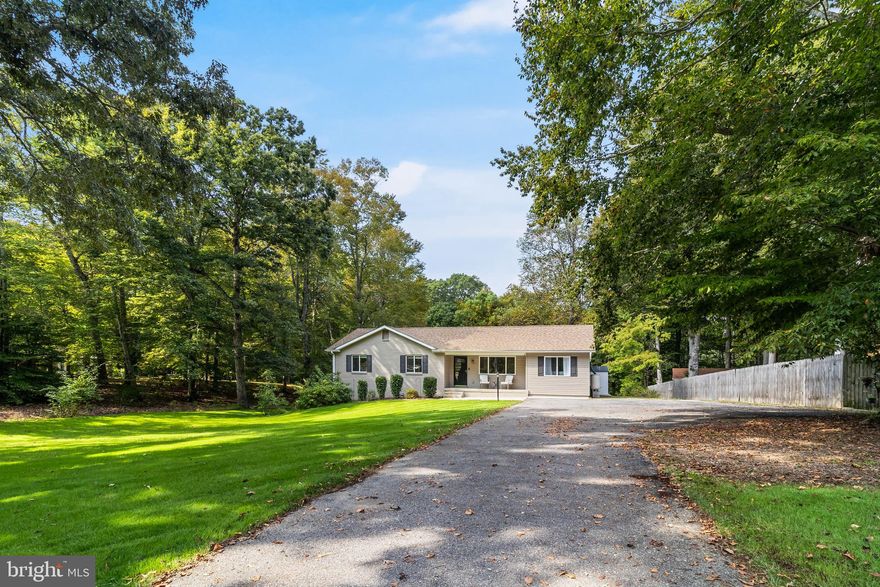 Welcome Home! This charming 3-bedroom, 2-bath rambler sits on a spacious & private lot with no HOA. Pulling up to 6945 Rose Lane, you’re greeted by lush green grass covering a large flat yard and an inviting front porch that sets the tone for what’s inside. Step through the door into a bright, open layout where the living and dining areas flow seamlessly into the kitchen and wood accent ceilings brighten up the space. The kitchen is the heart of the home, boasting granite countertops, stainless steel appliances, freshly painted grey cabinets, a designer tile backsplash, and an island accented with custom tile. Crown molding runs throughout the home, adding an elegant finishing touch. Just off the kitchen, a sliding door leads you to the covered back deck with recessed lighting, perfect for BBQ's, entertaining, or unwinding after a long day. Down the hall, you’ll find three comfortable bedrooms and two updated bathrooms. The primary suite offers double closets and a spa-like bath with a rainfall shower and new vanity. The second bath features grey marbled tile, modern lighting, and another new vanity. A coat closet and linen closet add extra convenience for storage and organization. The laundry room doubles as a pantry, complete with a new washer and dryer, utility sink, and generous storage space. The half basement provides even more flexibility with insulated walls and durable epoxy floors, ideal for a gym, workshop, or hobby room. With thoughtful updates, move-in ready convenience, and the freedom of no HOA, this home truly has it all. Schedule your showing today!