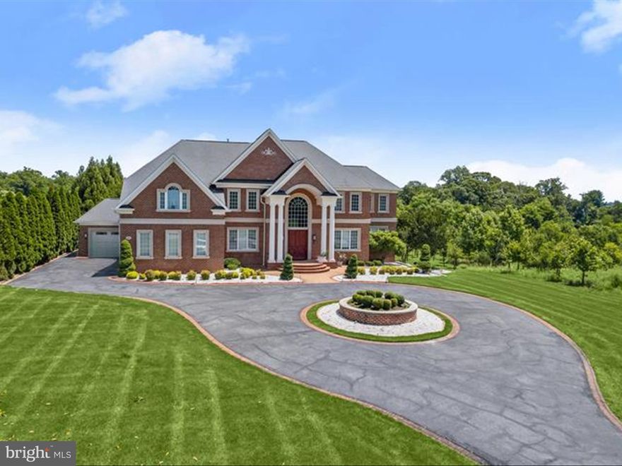 Experience unrivaled luxury and sophistication in this exquisite all-brick estate, featuring an extraordinary outdoor retreat and meticulously designed interiors. The backyard paradise is anchored by a heated Pentair IC-40 saltwater pool and a sprawling 1,100-square-foot pool house, complemented by multiple entertainment spaces and a thoughtfully crafted play area for children. Step inside to discover the recently renovated main level, a testament to fine craftsmanship and attention to detail. The grand foyer welcomes you with elegant lighting, stunning flooring, a gracefully curved staircase, and intricate architectural elements. Host gatherings in the formal dining room, showcasing a breathtaking vestibule ceiling, chair rail, and wainscoting, or retreat to the private study, complete with a gas fireplace and custom built-ins, ideal for remote work. The two-story family room, filled with natural light from expansive windows and French doors, offers picturesque views of the outdoor paradise. Adjacent is the custom-designed kitchen, a culinary masterpiece featuring a massive center island, professional-grade appliances, sleek cabinetry, a casual dining area, and a spacious walk-in pantry. A charming sunroom, a powder room, and an elevator complete the main level's offerings. The upper level is a sanctuary of comfort and luxury. The primary suite boasts a sitting area, a three-sided fireplace, a wet bar, and an enviable custom walk-in closet. The spa-inspired bath features an oversized shower, soaking tub, double vanities, and premium finishes. Three additional en-suite bedrooms and a convenient laundry room complete the upper level. The lower level is an entertainer’s dream, offering a custom bar, lounge area, playroom, exercise room, and a state-of-the-art home theater. A private in-law or au pair suite with a bedroom, full bath, and living area ensures flexibility for guests or extended family. Designed for modern living, this home is equipped with Andersen windows and doors, an elevator serving all three levels, a 600-amp electrical service, and a Generac 48kW natural gas backup generator. Perfectly situated in a prime Clarksville location, this residence effortlessly combines privacy, convenience, and unparalleled quality. This exceptional home has everything you need and so much more!