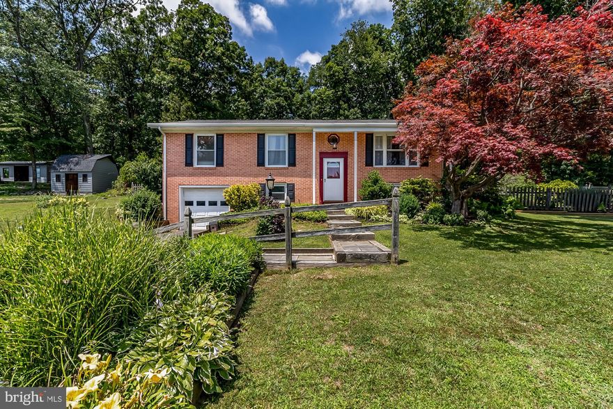 Beautiful home in a great neighborhood! Open floor plan with large kitchen overlooking a first floor family room addition with new pellet stove. 3 Bedrooms on top level with 1.5 baths. Hardwood floors. Newer windows throughout. New central air installed on top level. Lower level has a finished rec. room, additional bedroom and full bath. Basement has been waterproofed.  One car garage. The oversized backyard is gorgeous! Fully fenced with a deck and fire pit area to enjoy this summer!